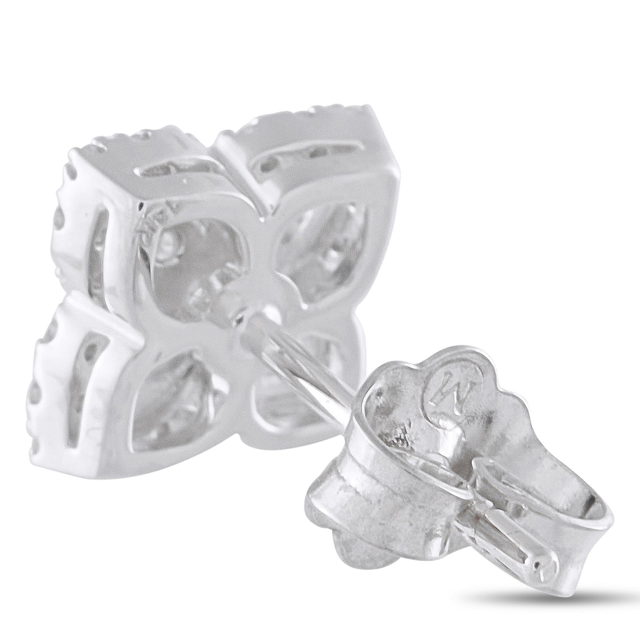 These elegant earrings are perfect for any occasion. Diamonds with a total weight of 0.25 carats at the center of the design makes them instantly captivating. Set in 14K White Gold, each earring measures 0.25 round.This jewelry piece is offered in