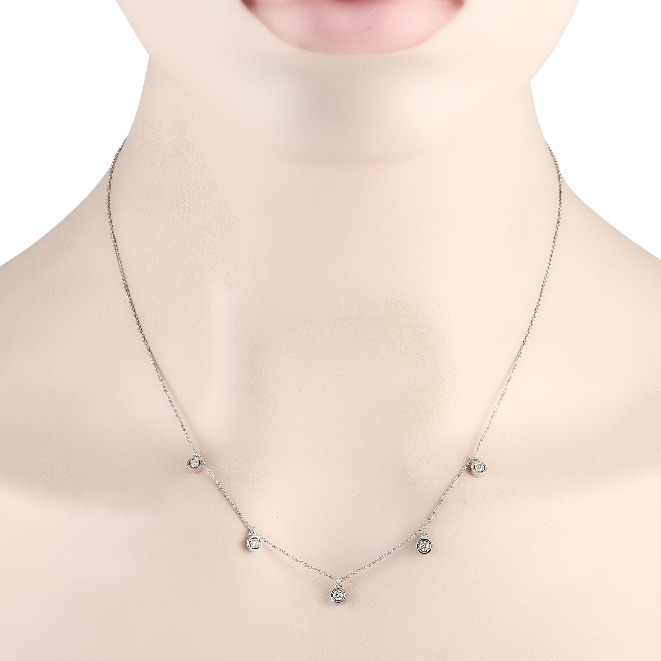 A series of bezel-set Diamonds with a total weight of 0.25 carats give this chic necklace its distinct sense of understated elegance. Ideal for everyday wear, this exquisite accessory is crafted from 14K white gold and features an 18 chain.This