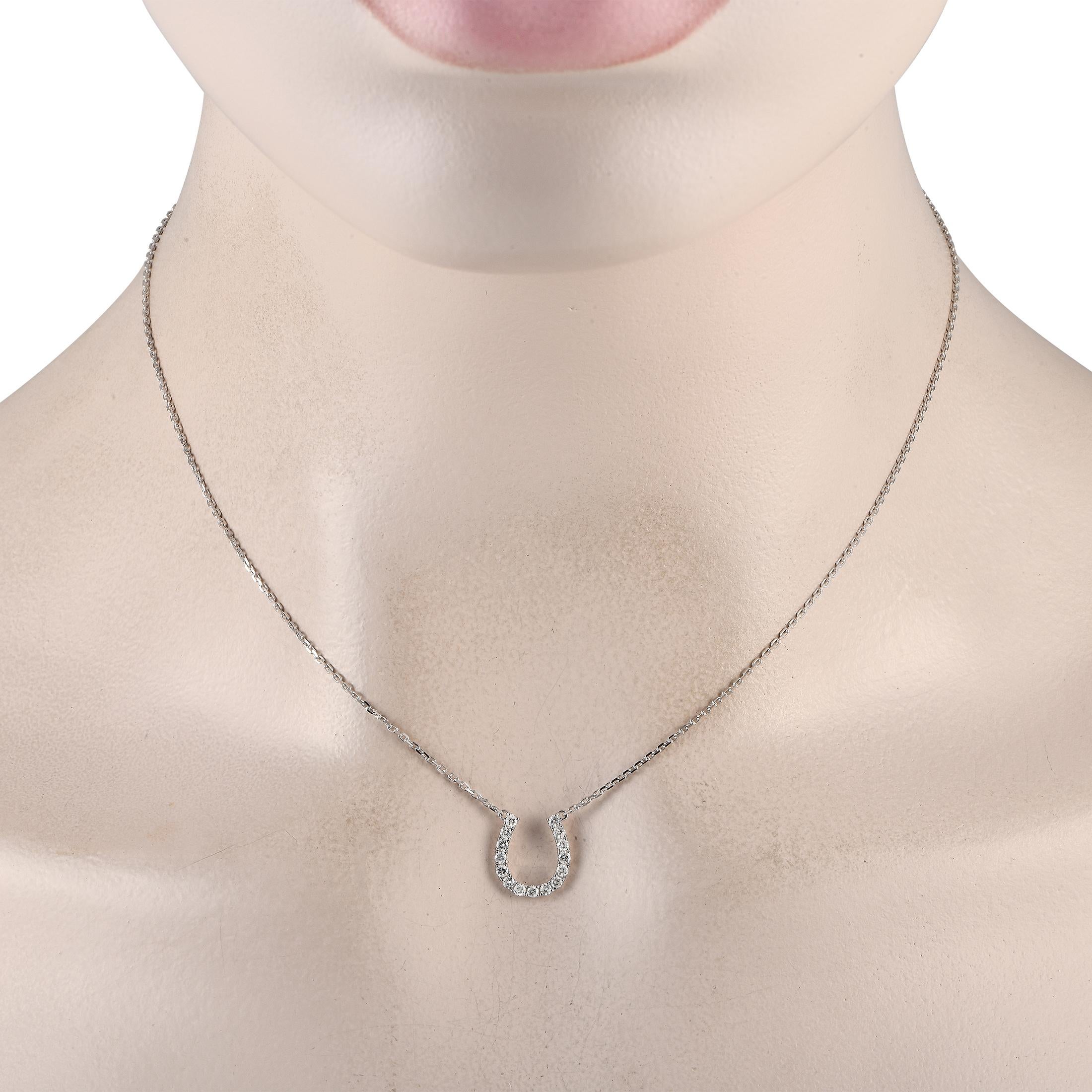 This exquisite 14K white gold necklace promises to bring good luck to the wearer. At the center of this pieces delicate 16 chain, youll find a glittering horseshoe shaped pendant that measures 0.50 long by 0.45 wide. Diamonds with a total weight of