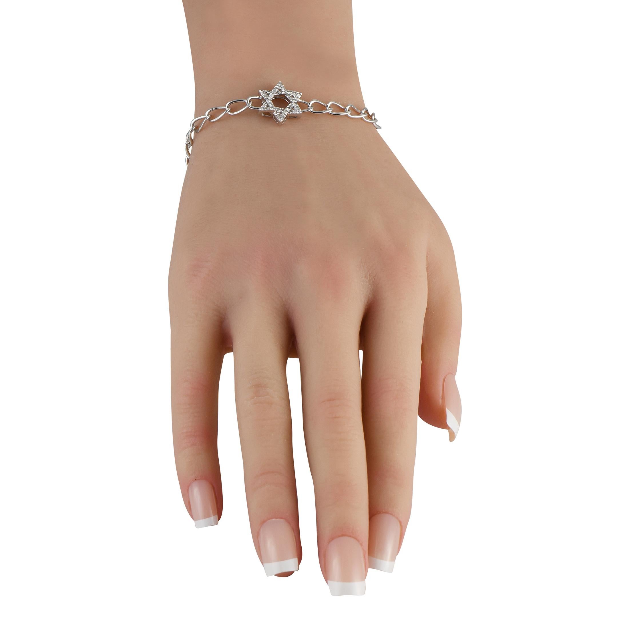 This classically elegant bracelet is poised to make a statement. At the center, a stunning six pointed star pendant is elevated by inset Diamonds totaling 0.30 carats. Crafted from 14K White Gold, the chain measures 7.0 long.This jewelry piece is