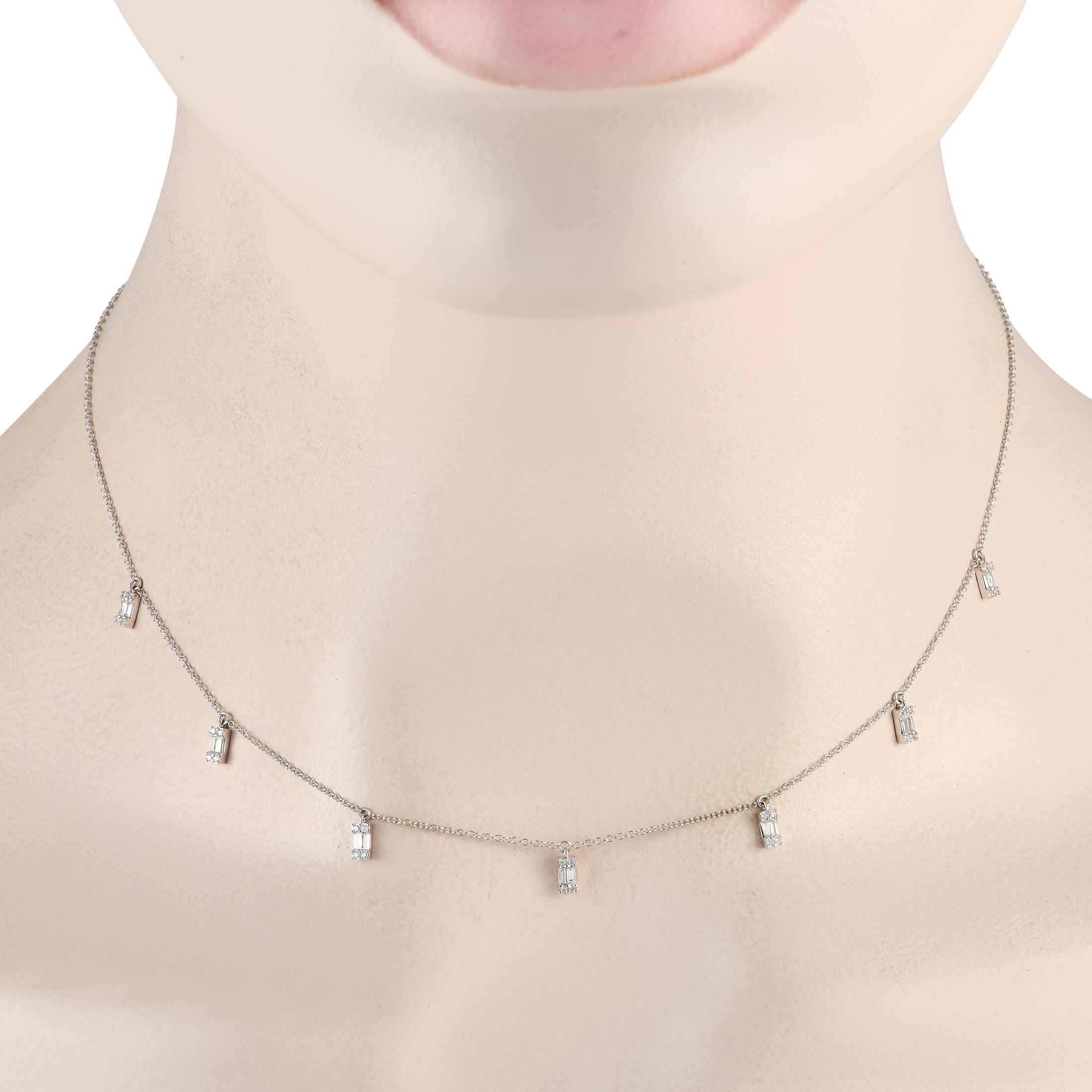 Here is an necklace perfect for adding a touching of modern elegance to your looks. The 14K white gold necklace chain measures 16 long and has a lobster clasp. Hanging from the central portion are seven diamond stations, with each station bearing