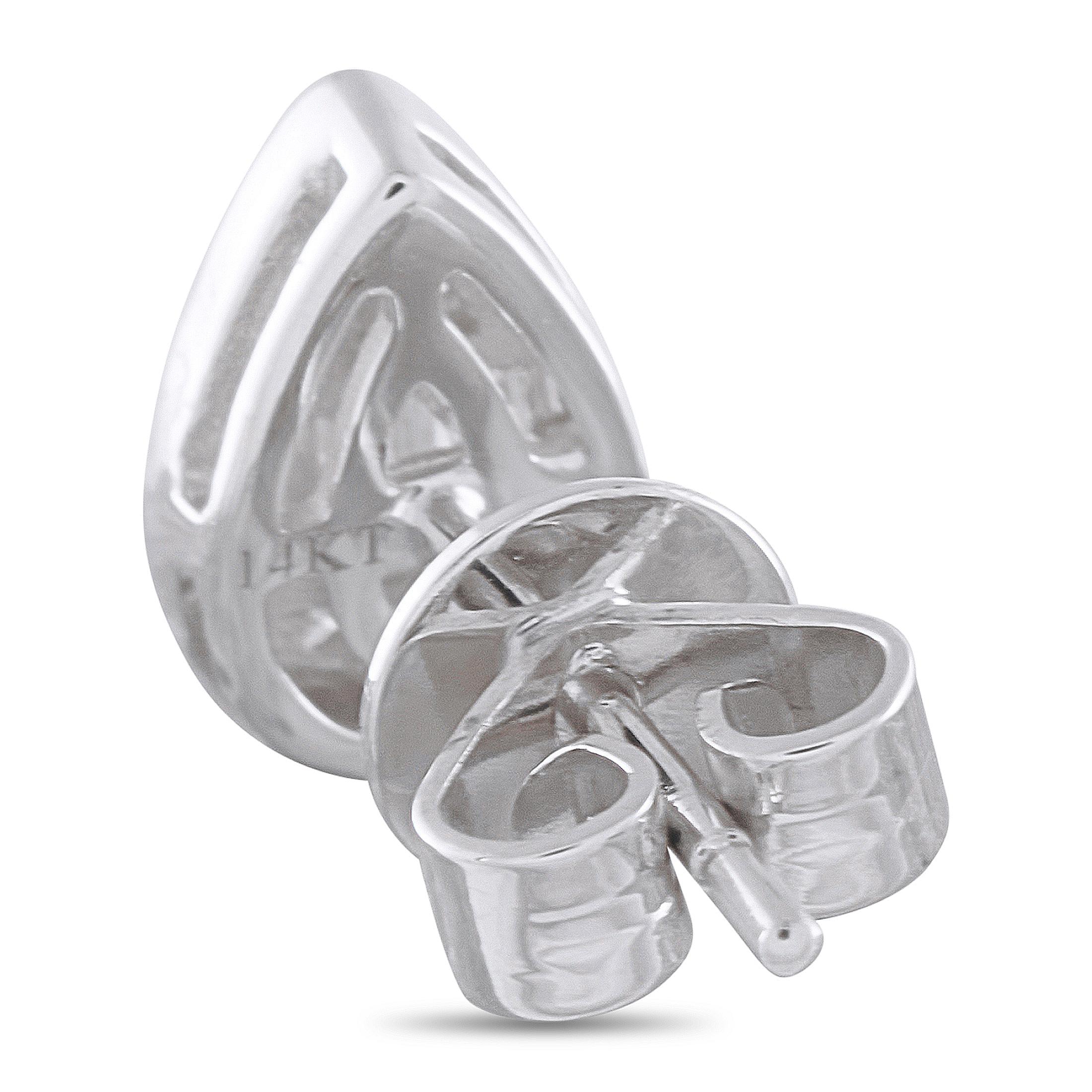 A 14K White Gold teardrop shaped setting makes these earrings an instant classic. At the center, a creative arrangement of Diamonds totaling 0.35 carats allows them to effortlessly catch the light every time theyre worn. Each earring measures 0.32