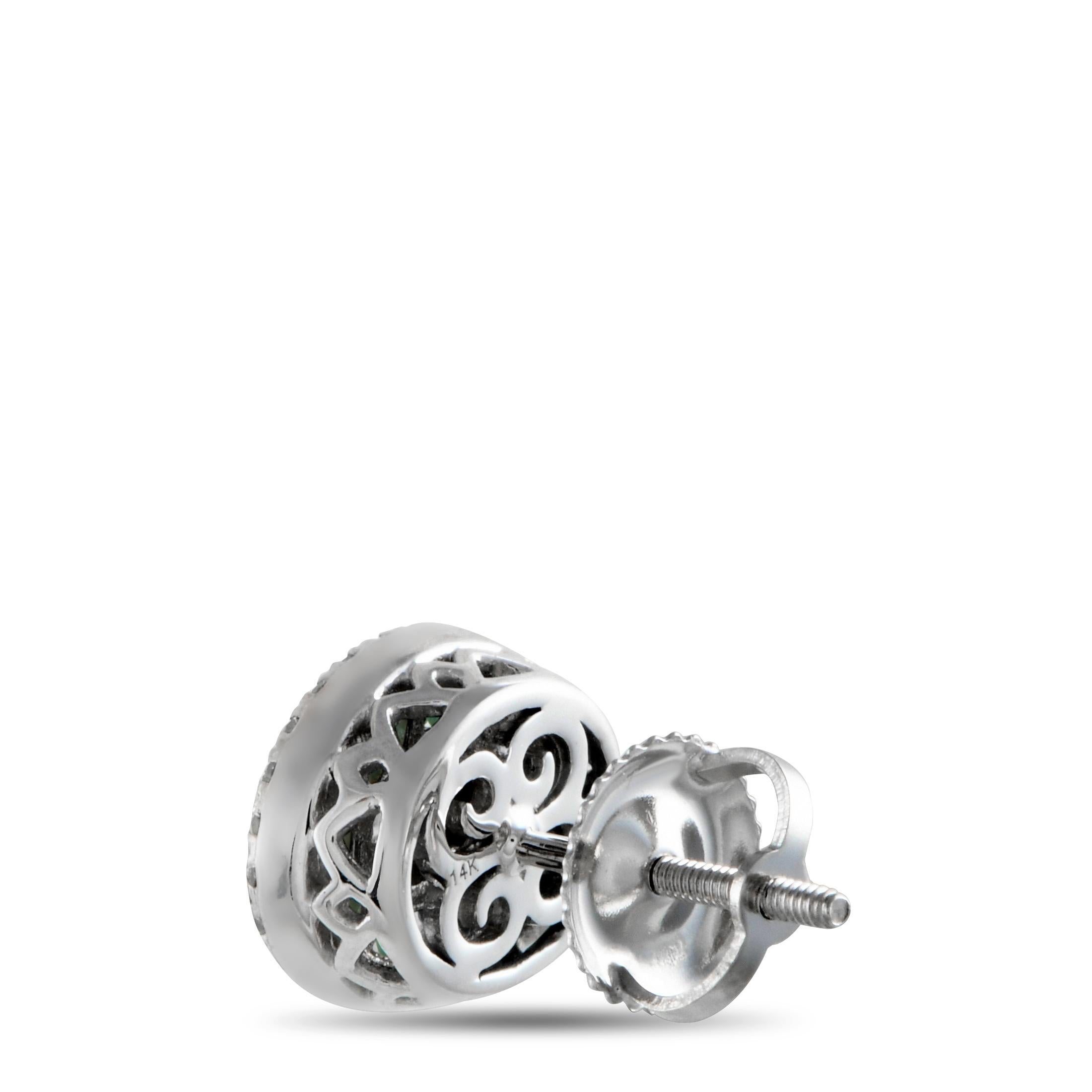 Reach for this pair when you feel the need to add a bit more bling and a hint of elegant color to your ensemble. These 14K white gold earrings shine with oval-shaped clusters of round and step-cut diamonds. Each cluster is surrounded by an oval halo