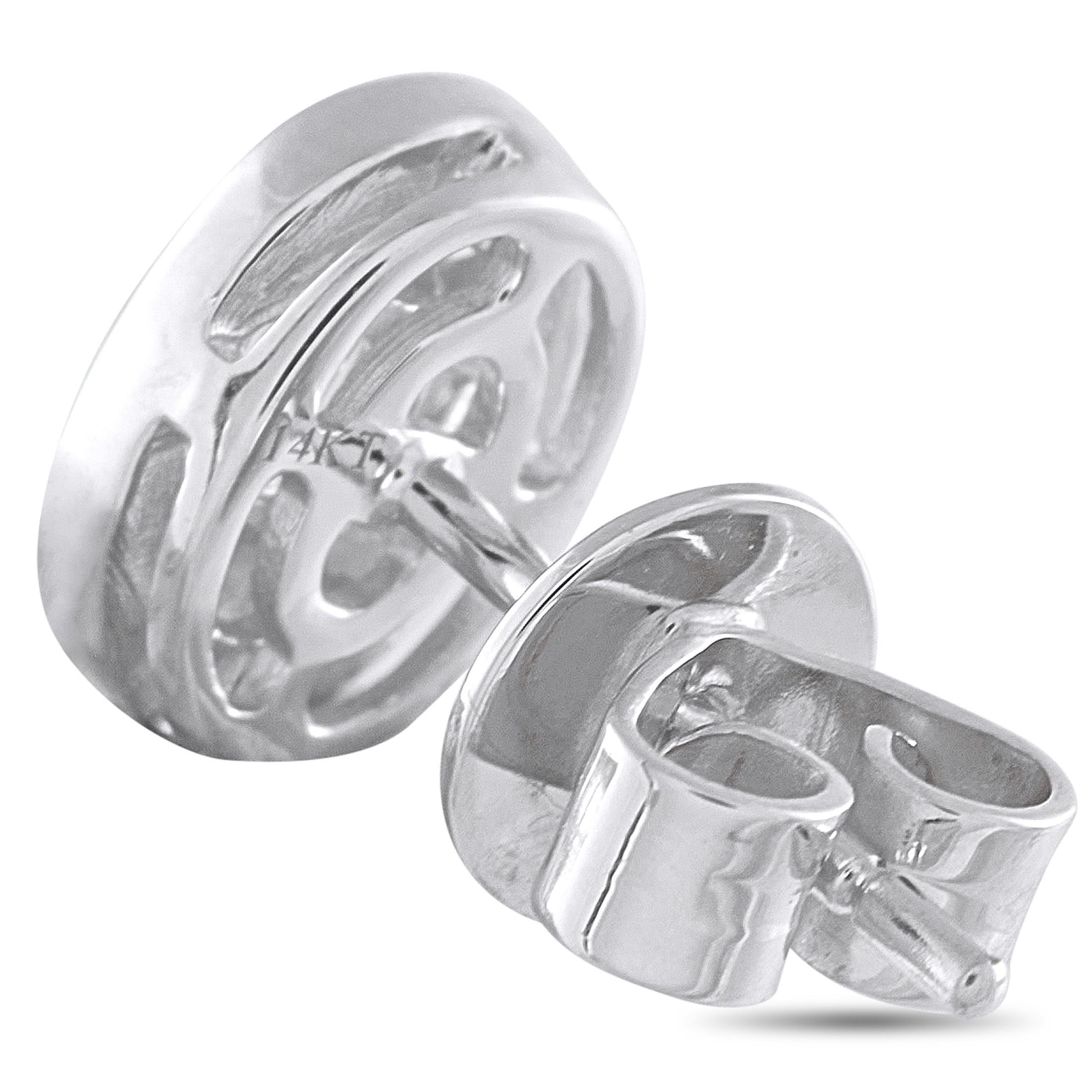 An oval-shaped setting makes these luxury earrings a timeless addition to any jewelry collection. Sleek and elegant, they come to life thanks to a sparkling array of Diamonds totaling 0.40 carats. Each one is crafted from 14K White Gold and measures