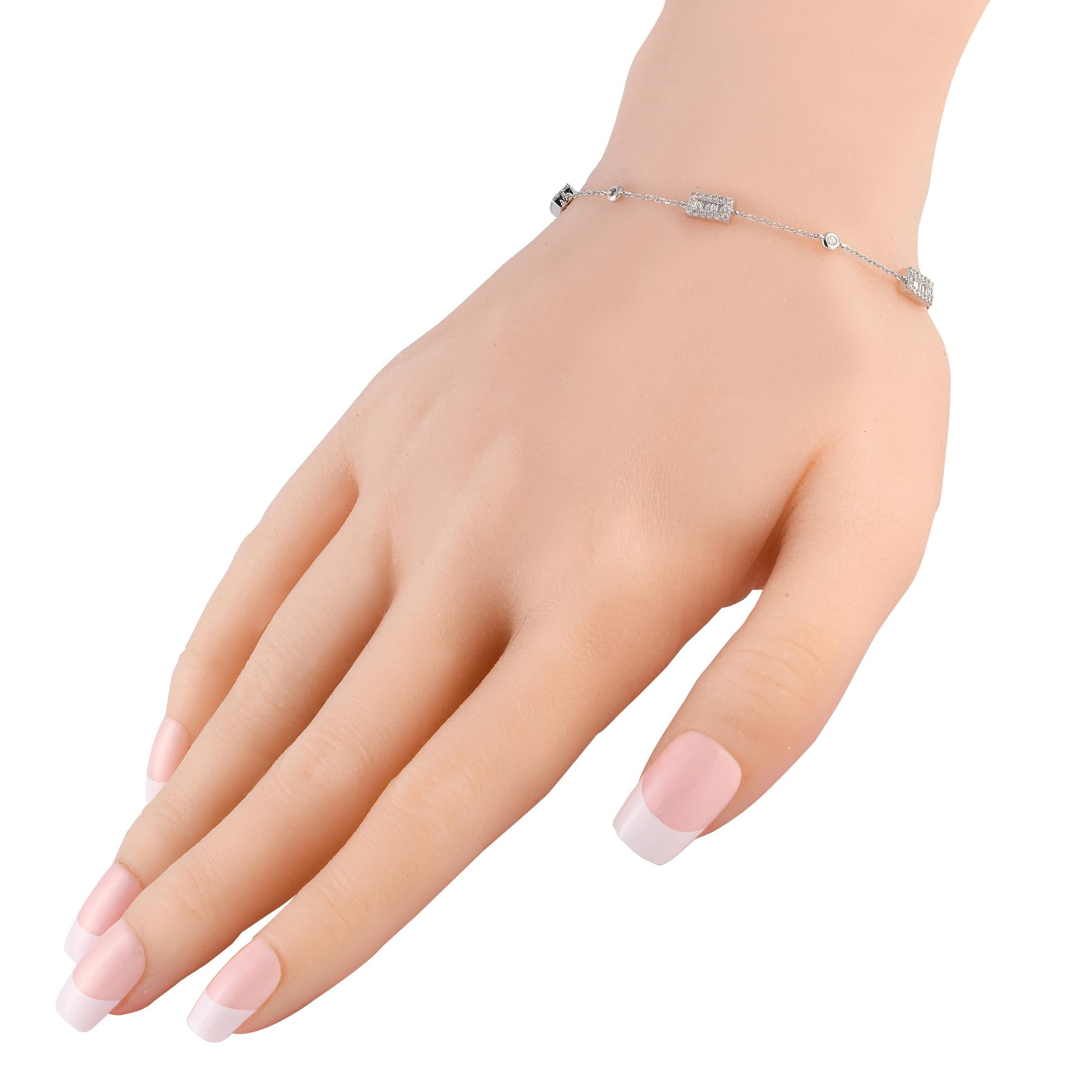 This bracelet is a simple stunner that looks good on its own or layered with other bracelets. It is crafted in 14K white gold and designed with an alternating pattern of bezel-set round diamonds and diamond clusters in a rectangular setting.This