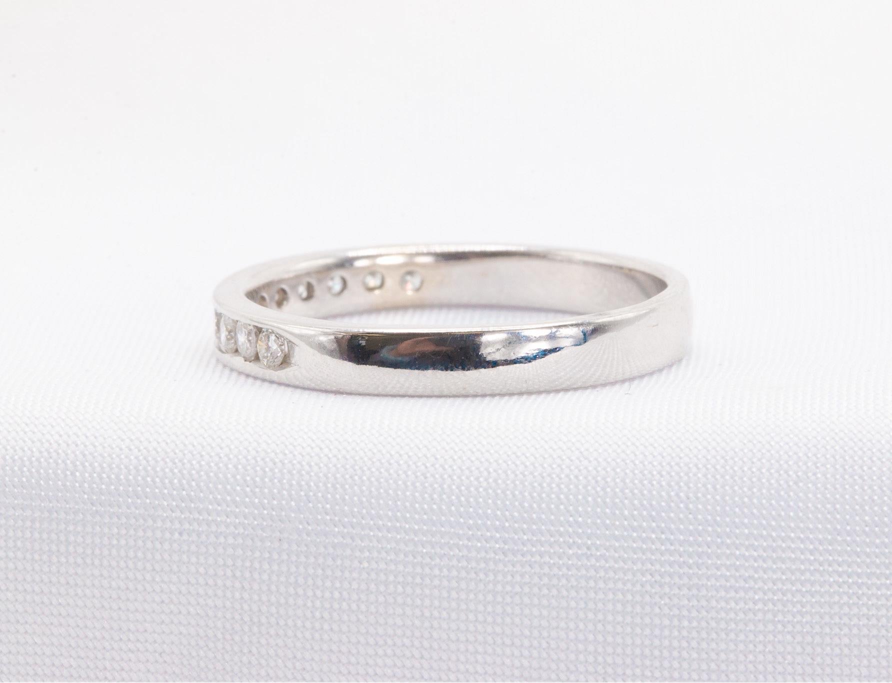 This elegant 14k white gold band is adorned with approximately 0.50 carats of round-cut diamonds, graded G-H in color and VS in clarity, offering a refined touch of brilliance. Weighing 2.9 grams, this timeless and versatile design is ideal for