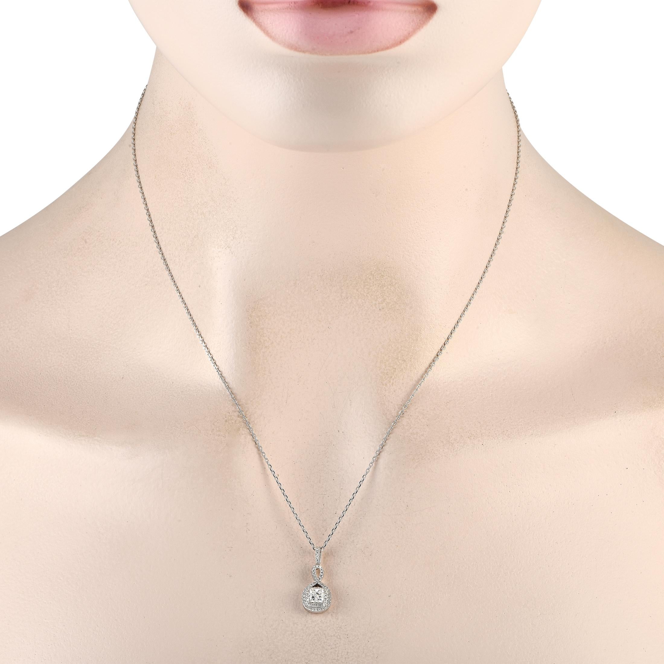 This elegant necklace makes it easy to add a touch of luxury to absolutely any ensemble. Suspended from a delicate 18 chain, this impeccably crafted accessory features a 14K White Gold pendant measuring 0.75 long by 0.45 wide. Diamonds with a total