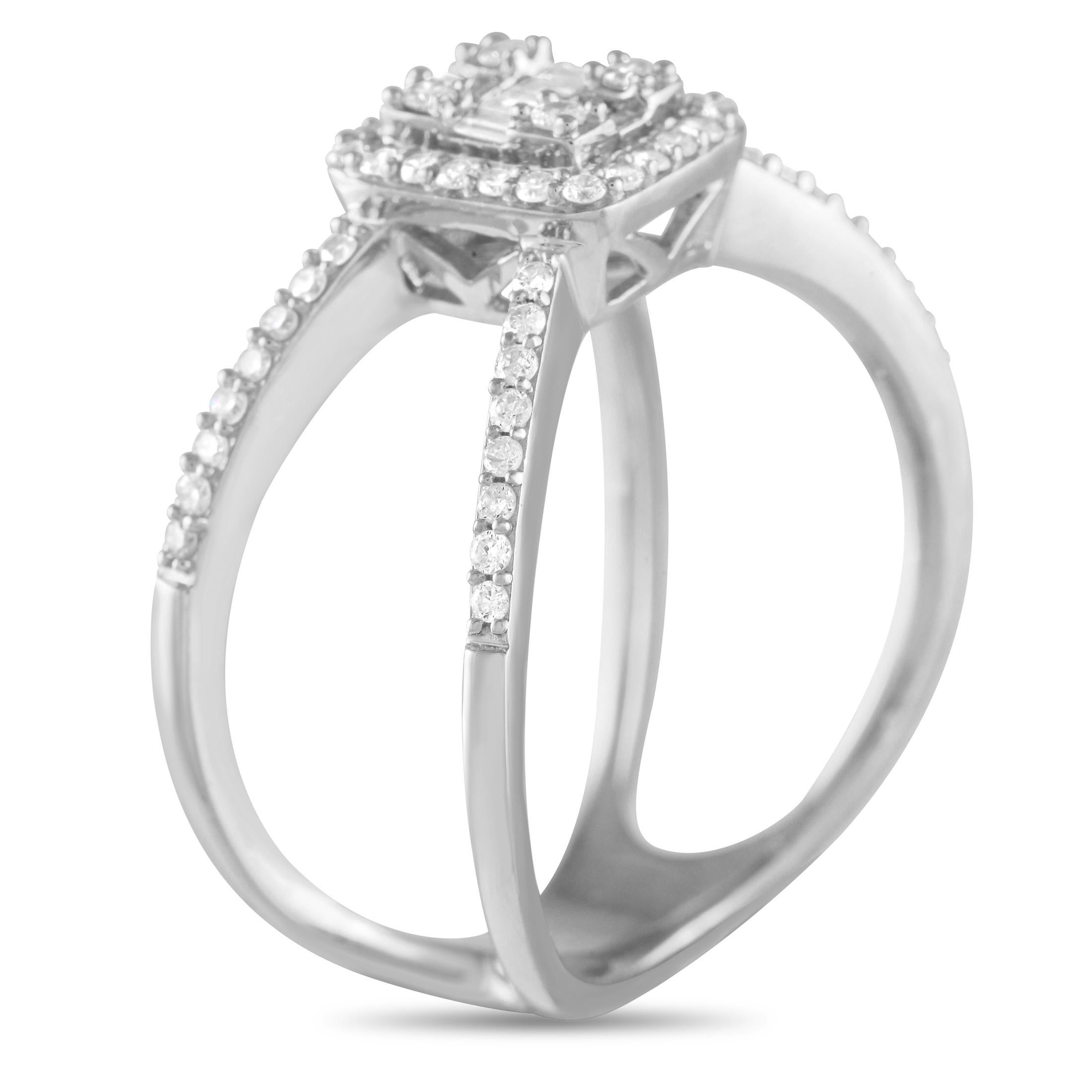 This stunner reflects the true essence of an empowered woman. With its confident stance and unabashedly attractive design, the ring is a force to be reckoned with. This piece in 14K white gold features two narrow shanks that cross over, forming a