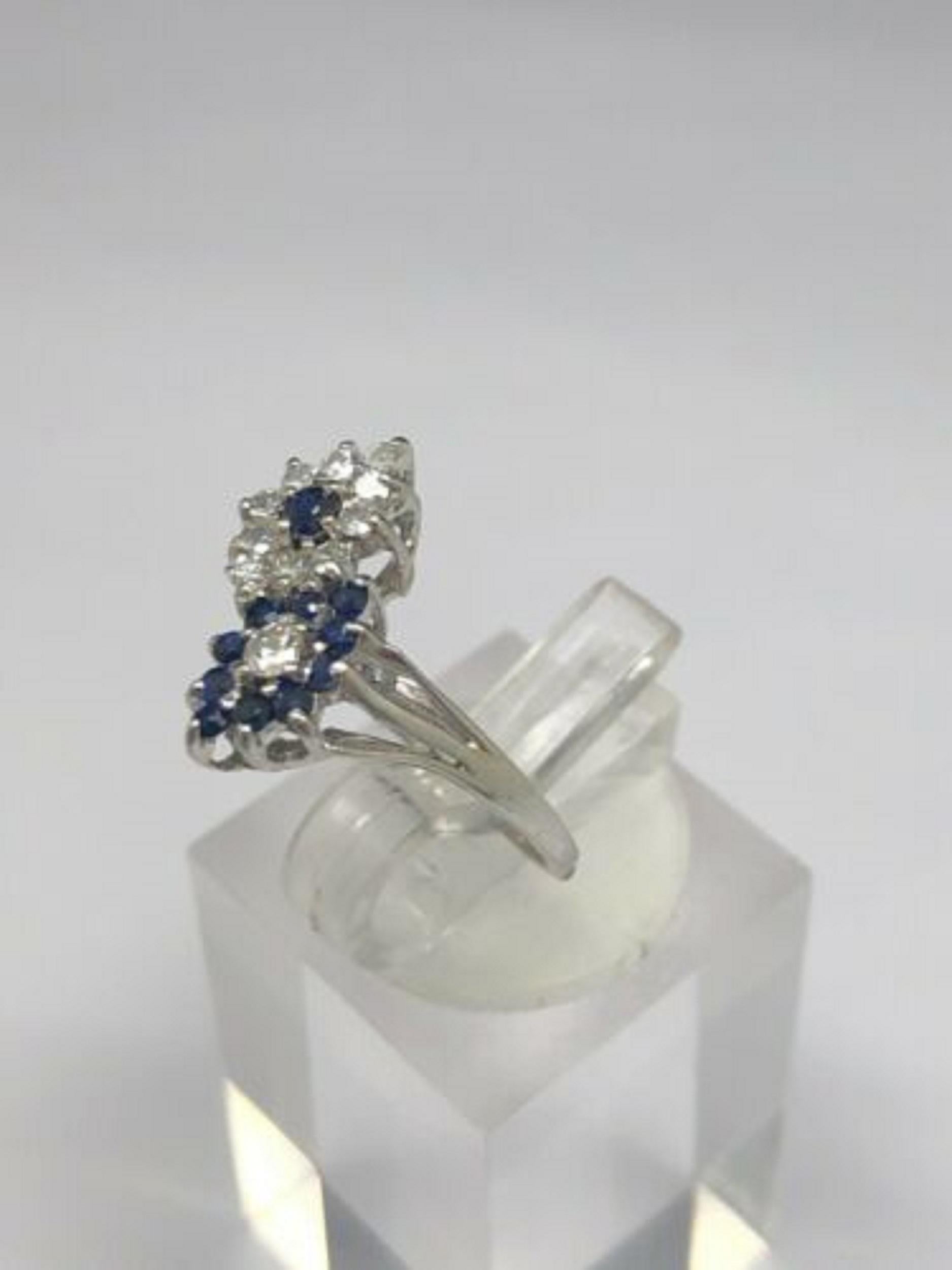  Up for sale:

This absolutely stunning vintage solid 14k white gold round cut natural diamond and round cut natural blue sapphire gemstone cocktail ring. This ring is featuring approx 0.50ctw in round cut natural blue sapphire gemstones and round