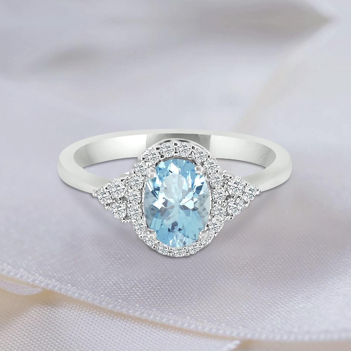 Get Her A Gift She Will Want To Wear Everyday. This Elegant Shade Of light Blue Is Perfect To Welcome In Spring - Plus, Its March's Birthstone.
This Classic Ring Showcases A Oval Shaped 7x5mm Aquamarine Gemstone Haloed By Sparkling