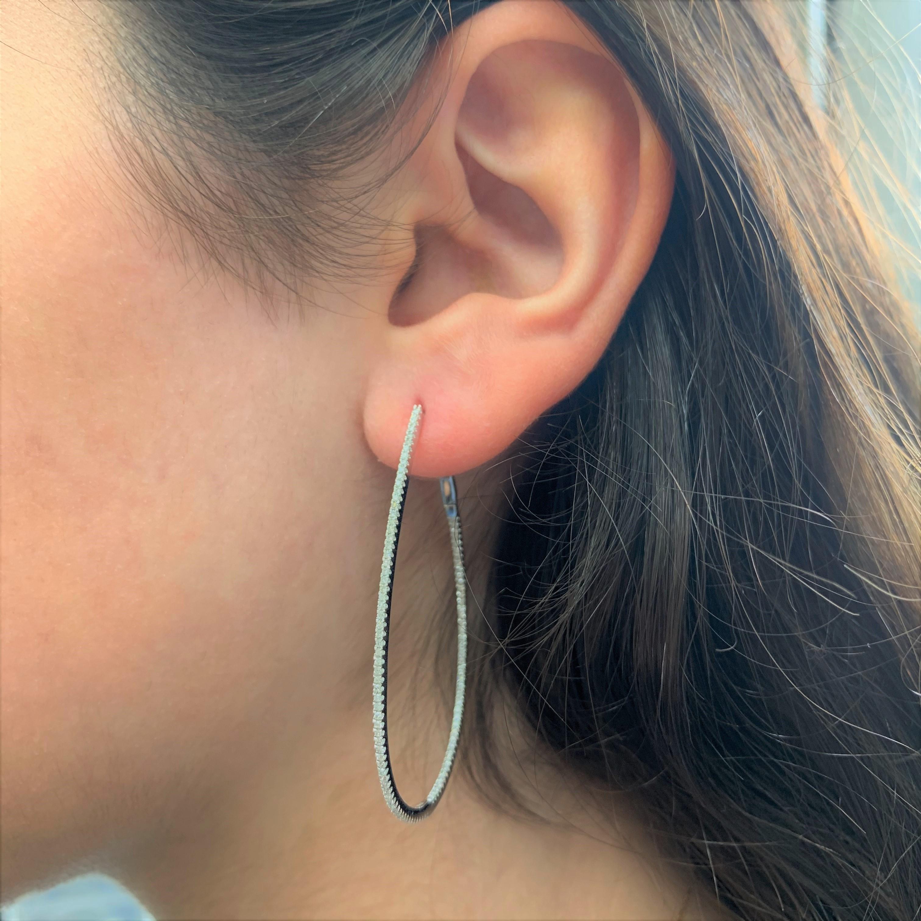 Set your lobes aglow in the classic shimmer and shine of these luxurious pear shape skinny hoop earrings! A dazzling array of diamonds fire up and down the design crafted from 14k white, rose or yellow gold. Lever backs offer easy application so you