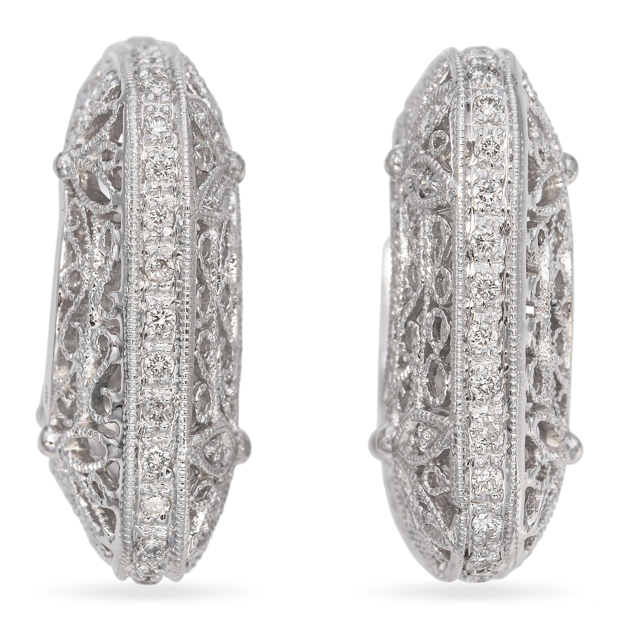 Intricate and elegant, these earrings feature a delicate filigree design in 14k white gold. The openwork pattern is adorned with round, white diamonds totaling 0.66 carats, adding a subtle sparkle.

Weight: 9.3 Grams
Stone: 0.66 TCW Diamond (0.01