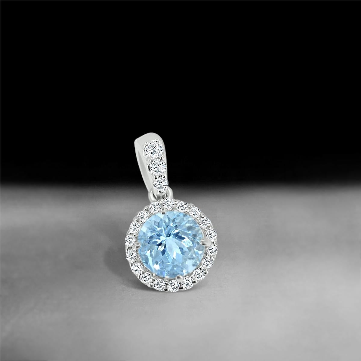 It's Classic Elegance And Timeless Styling Makes This Pendant, The Perfect Gift To Yourself Or To Someone You Love. A 6mm Round Aquamarine Casts A Shimmer With The Border Of Diamonds Around It.
This Beautiful Gemstone Pendant Is Crafted In 14k White
