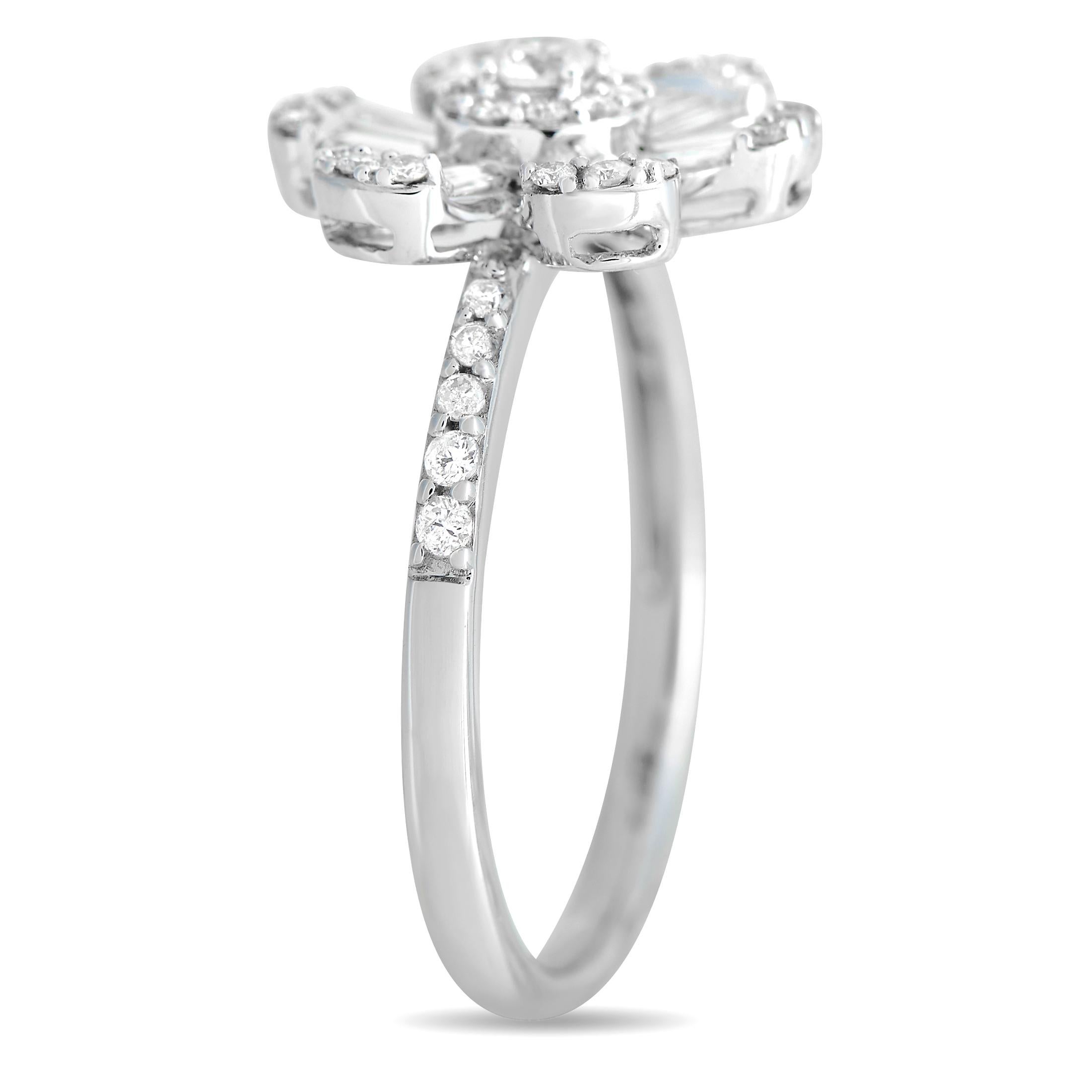 This ring's flower power and undeniable sparkle are sure to bring spring to your step. It is crafted in 14K white gold and has a chic, narrow band with shoulders daintily traced with diamonds. The focal point is an oversized flower centerpiece with