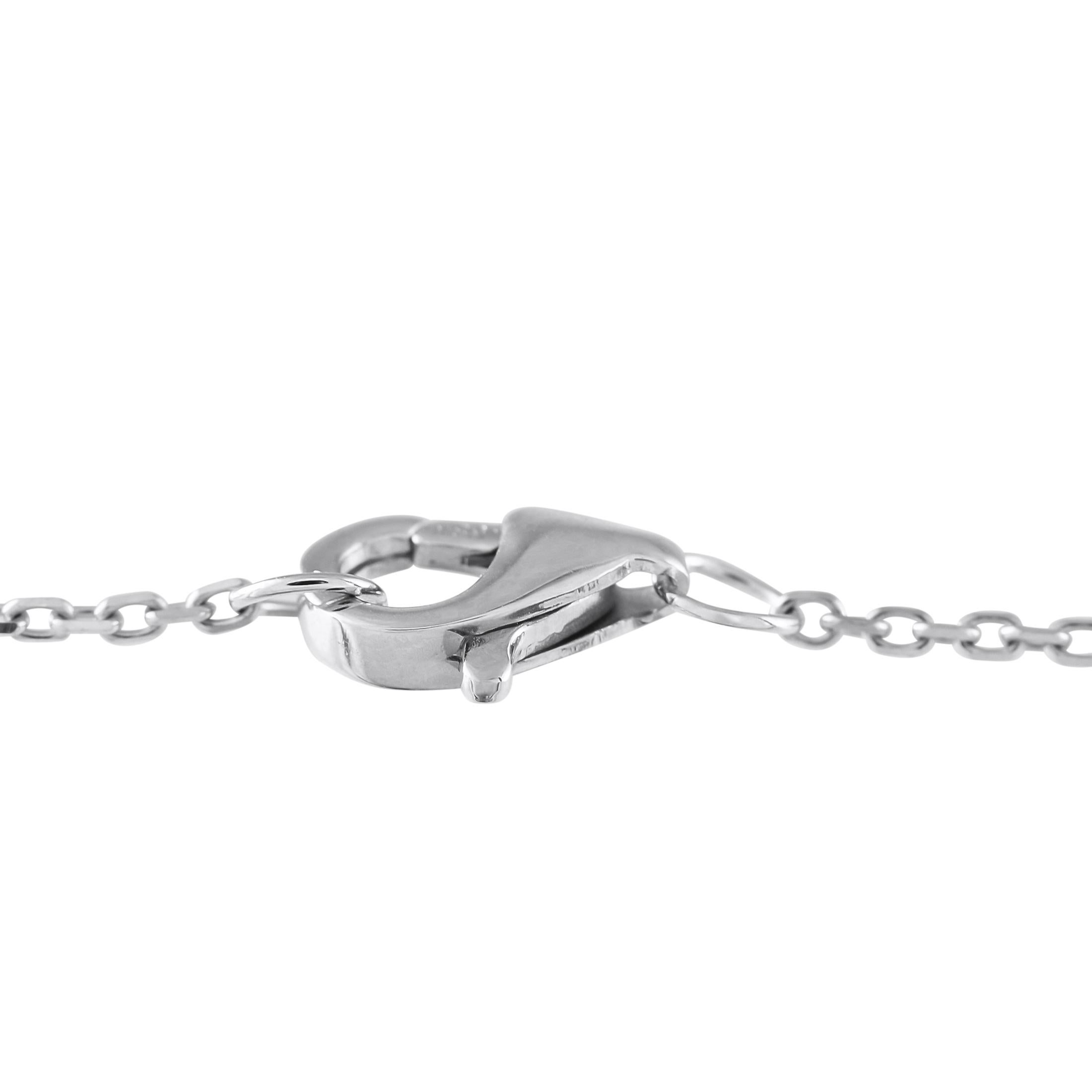 This designer inspired hand bracelet will leave you breathless. Chic and incredibly contemporary, the unique design attaches at your wrist and slips over your finger. Its delicate 14K White Gold chain is elevated by inset Diamond accents totaling