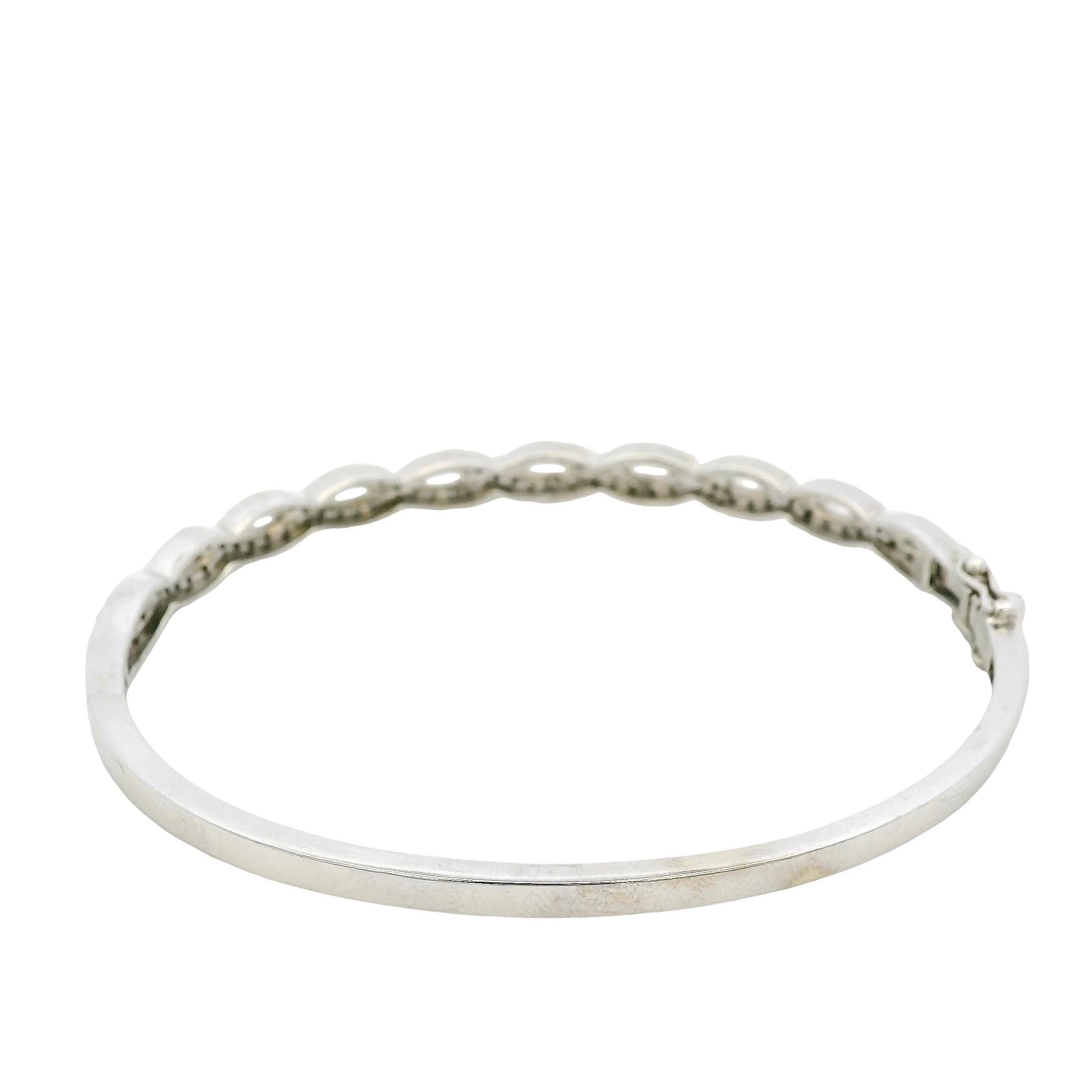 14k White Gold 0.85ctw Twisted Style Diamond Bangle For Sale 1