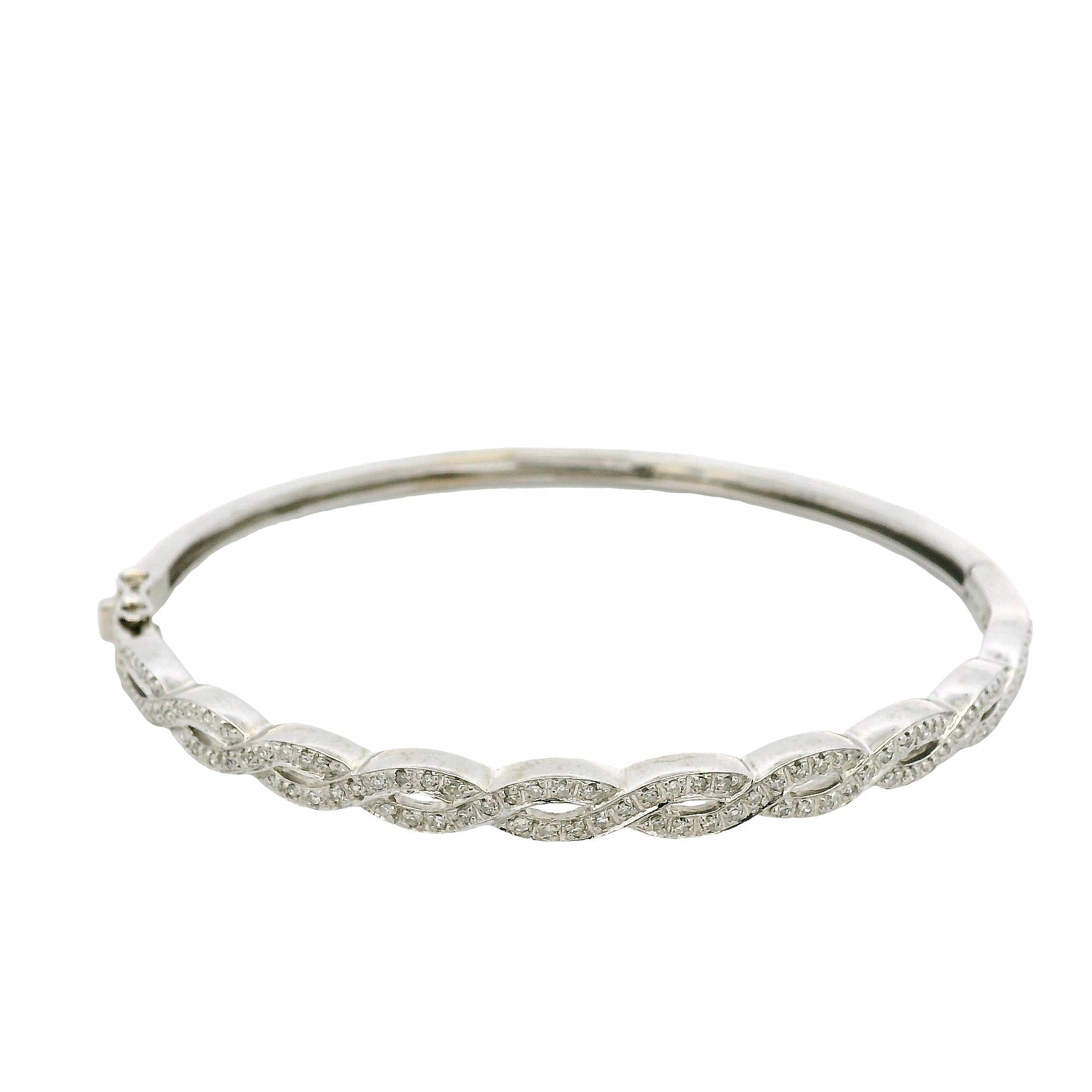 14k White Gold 0.85ctw Twisted Style Diamond Bangle For Sale 2