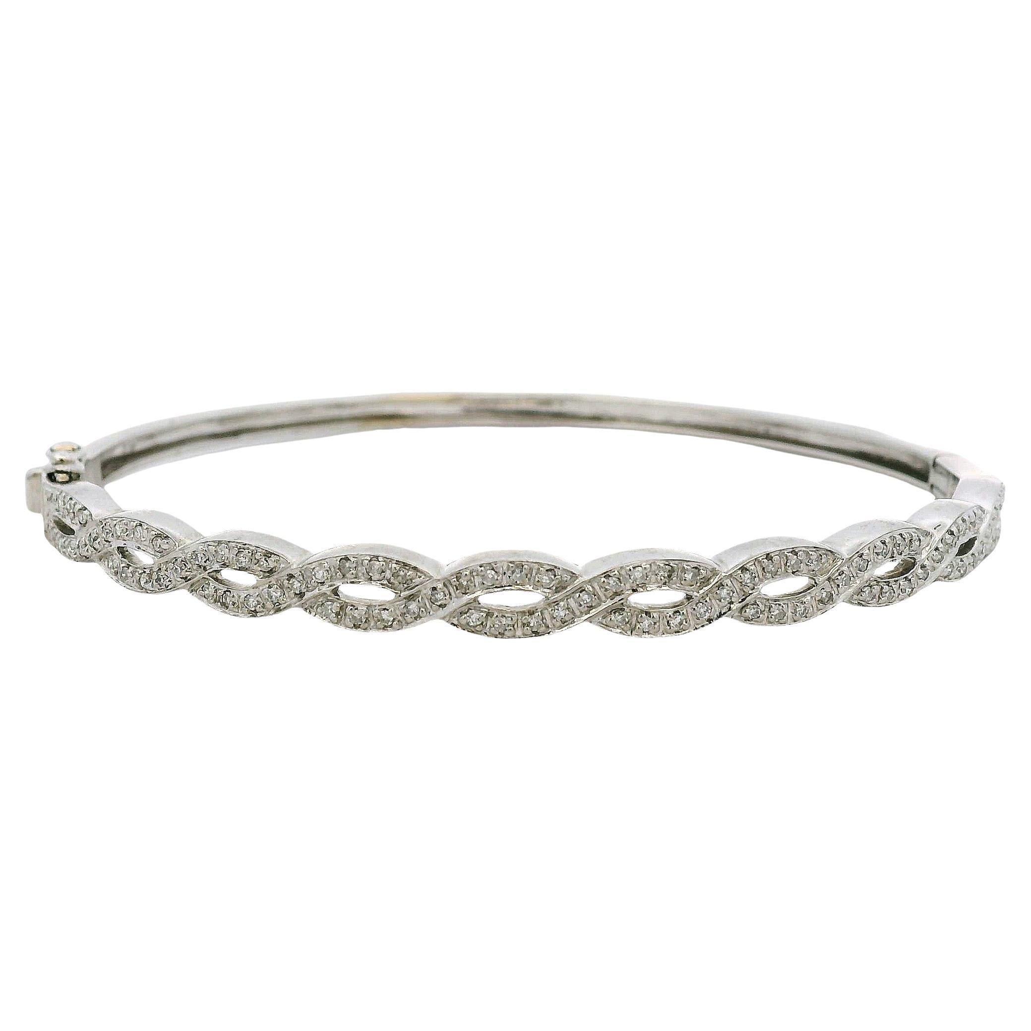 14k White Gold 0.85ctw Twisted Style Diamond Bangle For Sale
