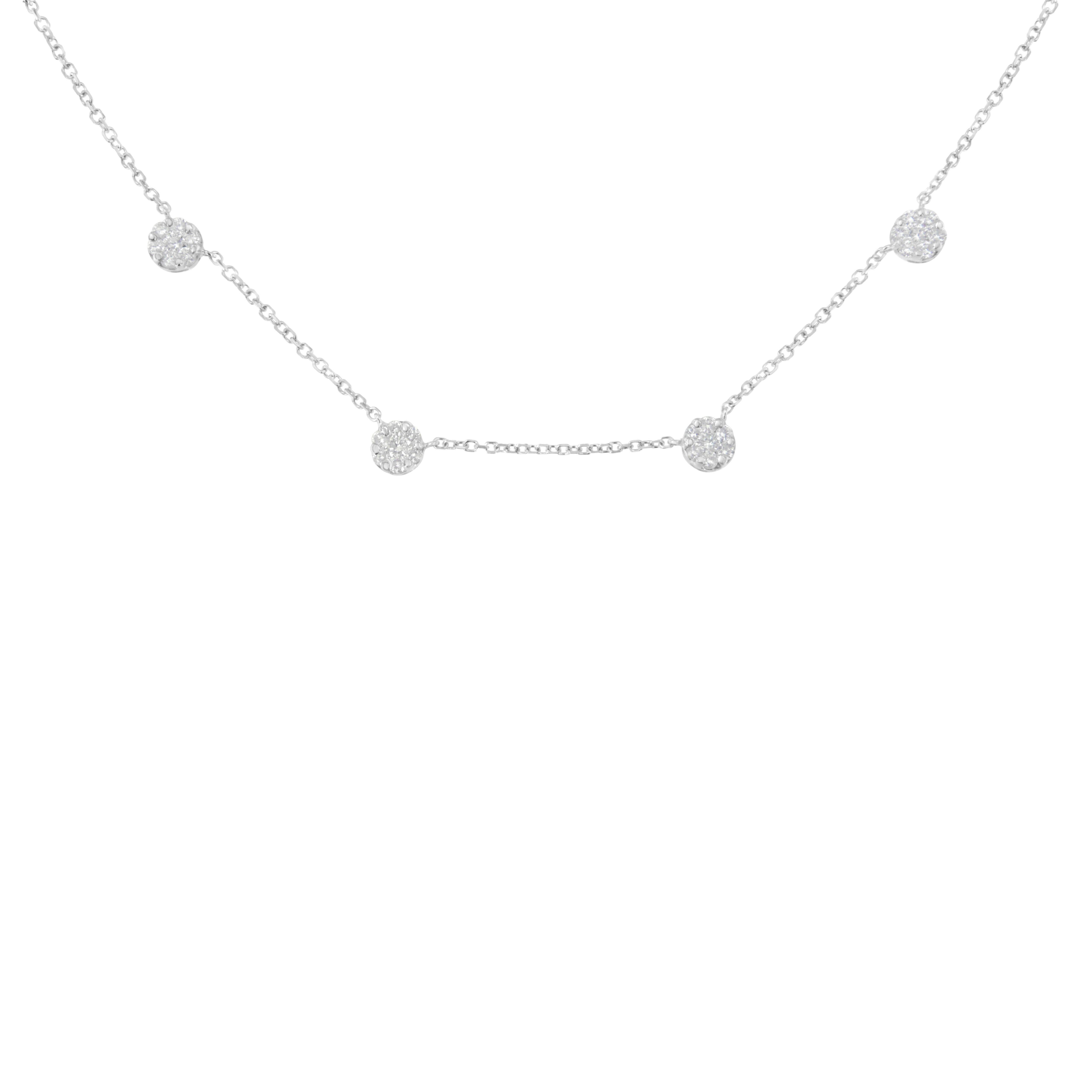 This delicate station necklace is created in 14k white gold and features 1 1/10ct TDW of diamonds. Four glittering, prong set, round cut diamond clusters are set along a box chain that secures with a lobster claw clasp. Adjustable 16-18