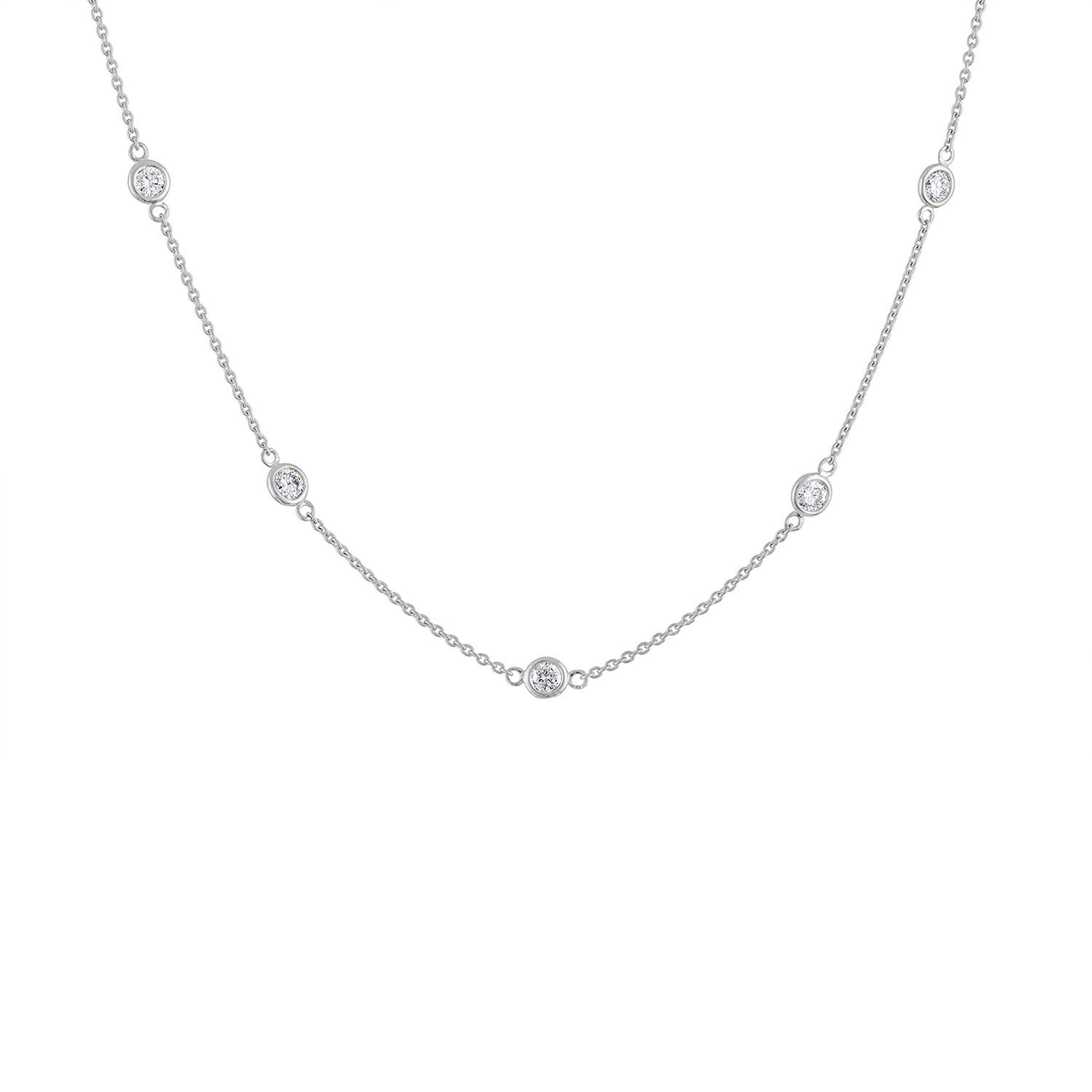 An accessory for any occasion, this petite necklace features sparkling bezel set, round-cut natural diamonds evenly spaced along a rolo chain. Embedded in 14k white gold, this 1ct station necklace will elevate any attire. 'Video Available Upon
