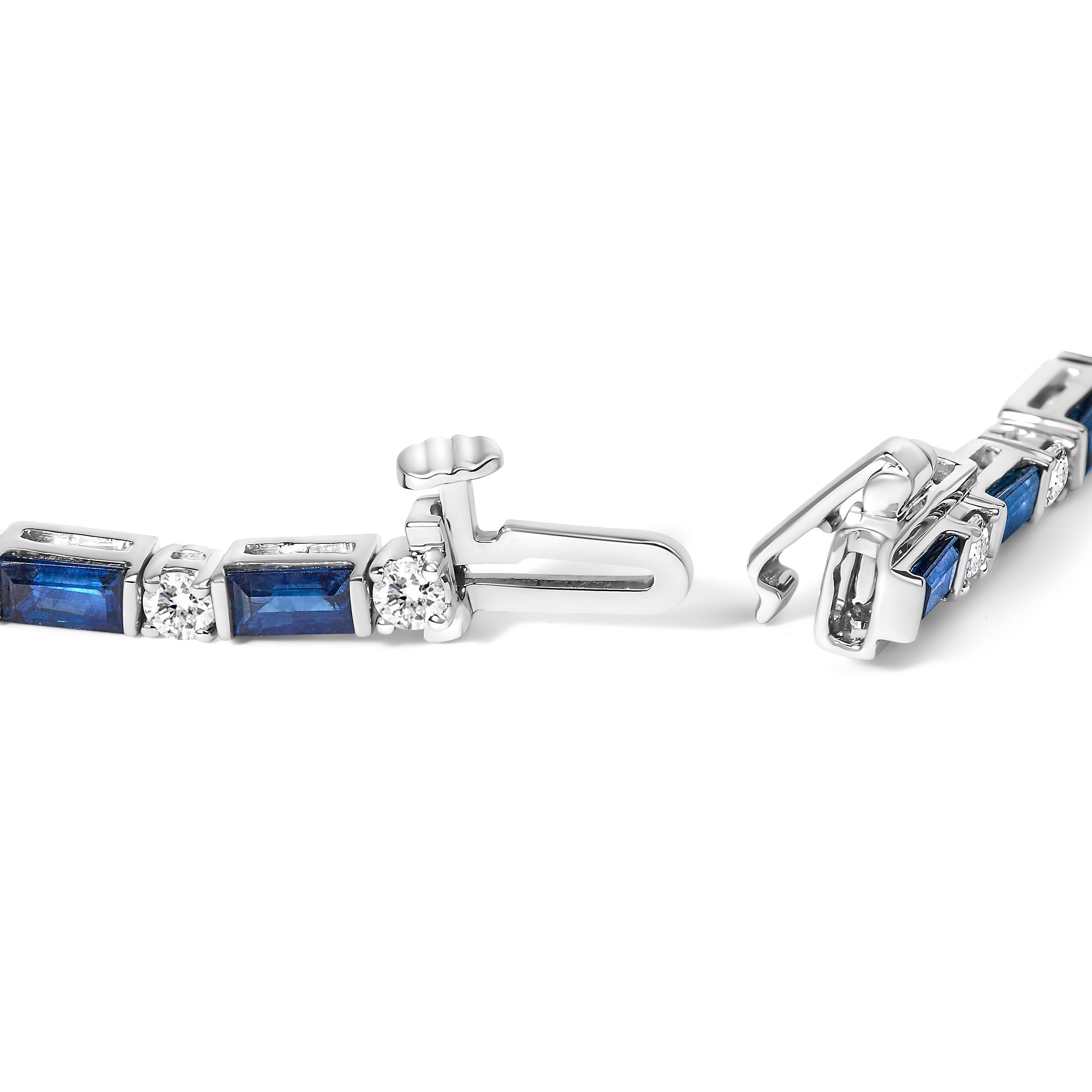 Elegance redefined, this breathtaking bracelet, adorned in 14K white gold and kissed with a rhodium finish, radiates an unmatched sparkle. Picture six carats of enchanting blue diamonds, their hues deep and evocative, masterfully set to mimic the