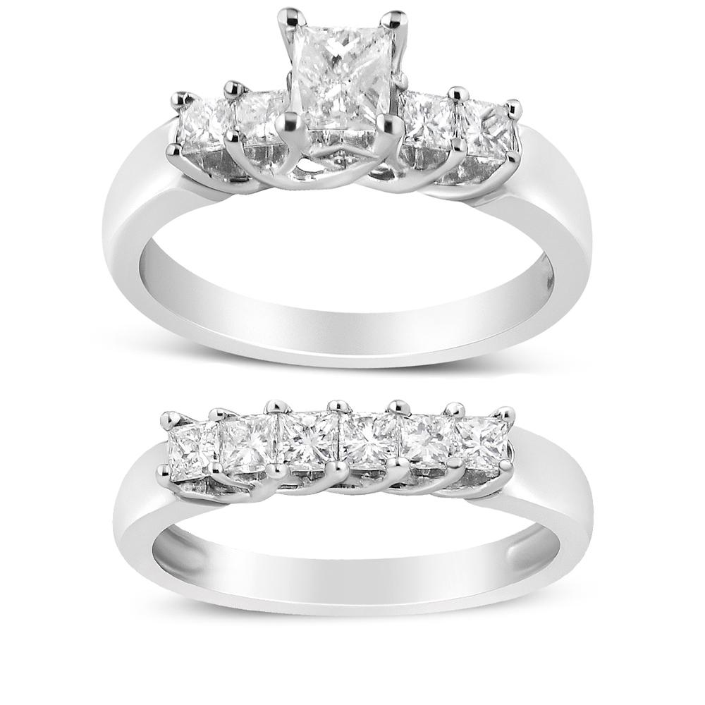 This 14k white gold diamond bridal set features a striking engagement ring and a matching wedding band. This classic five stone diamond engagement ring and matching wedding band feature a ½ ct center stone and 10 princess cut side diamonds. Each