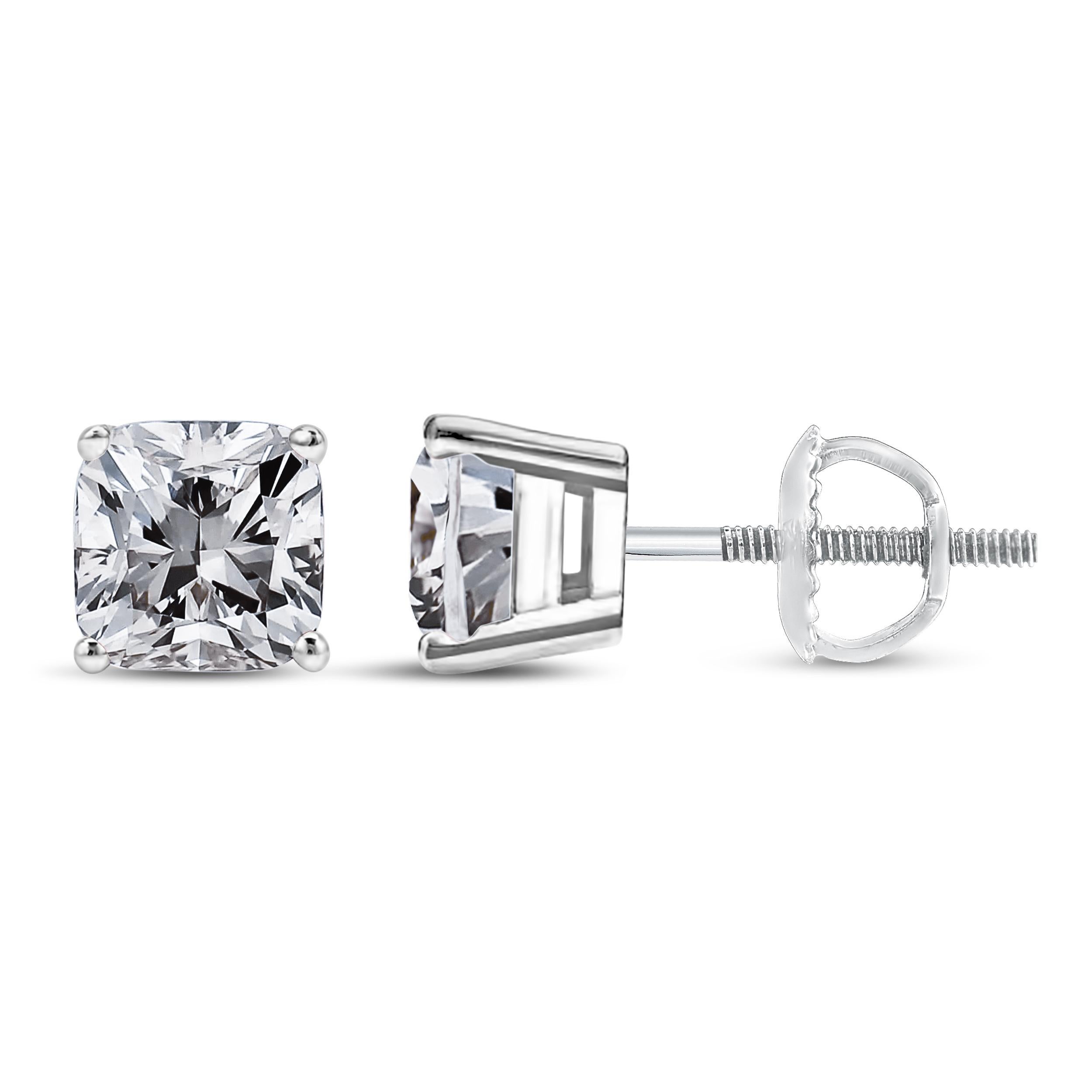 Diamond stud earrings are a classic and timeless accessory that every woman should have in her jewelry collection. These 14K white gold studs feature two princess cut diamonds that have been clarity enhanced, totaling 1 1/2 carats. Each diamond is