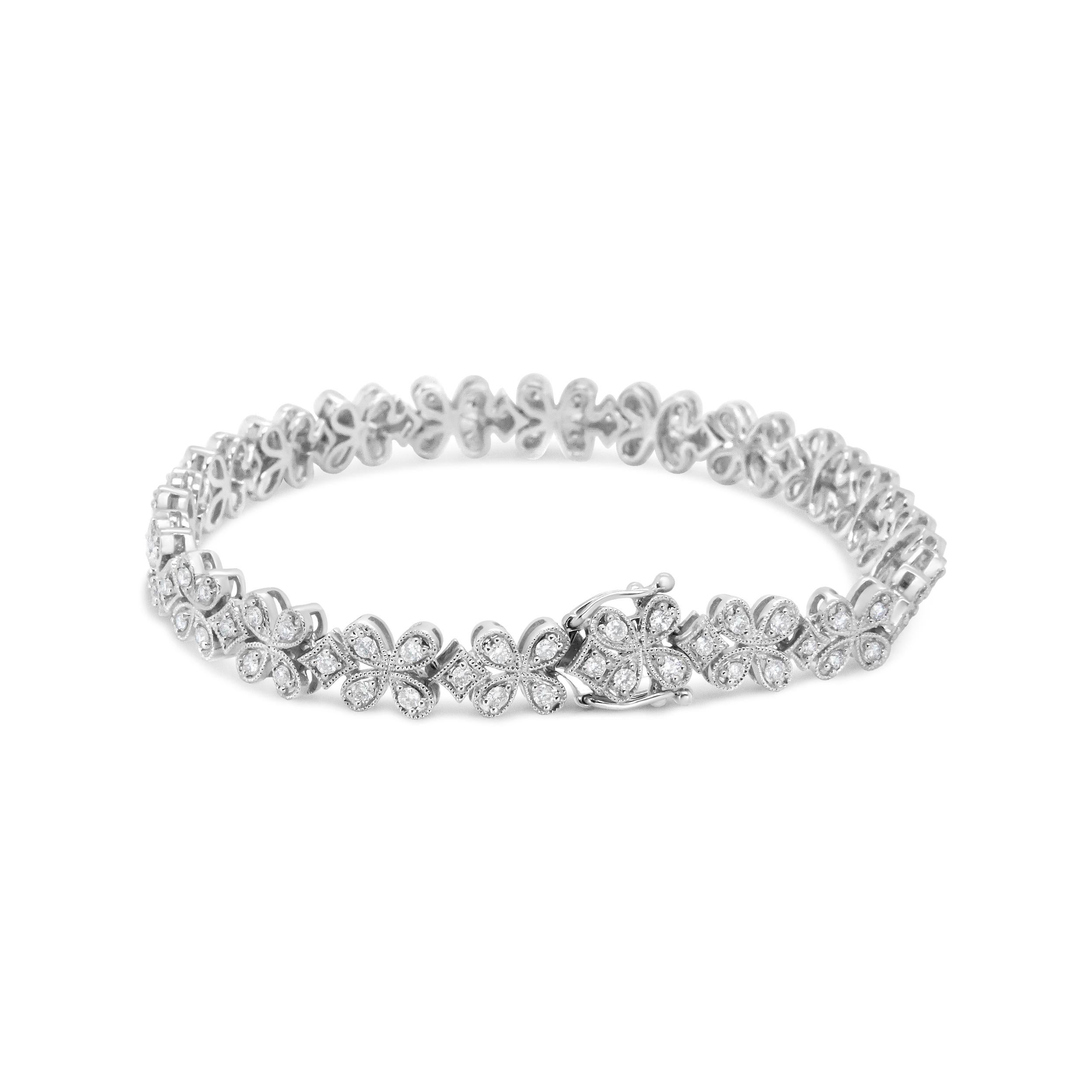This show-stopping diamond link bracelet is a masterpiece of delicate beauty with floral inspiration that takes a modern twist with clean, contemporary angles and the romantic glamour of 100 diamonds. The round white diamonds sparkle from their