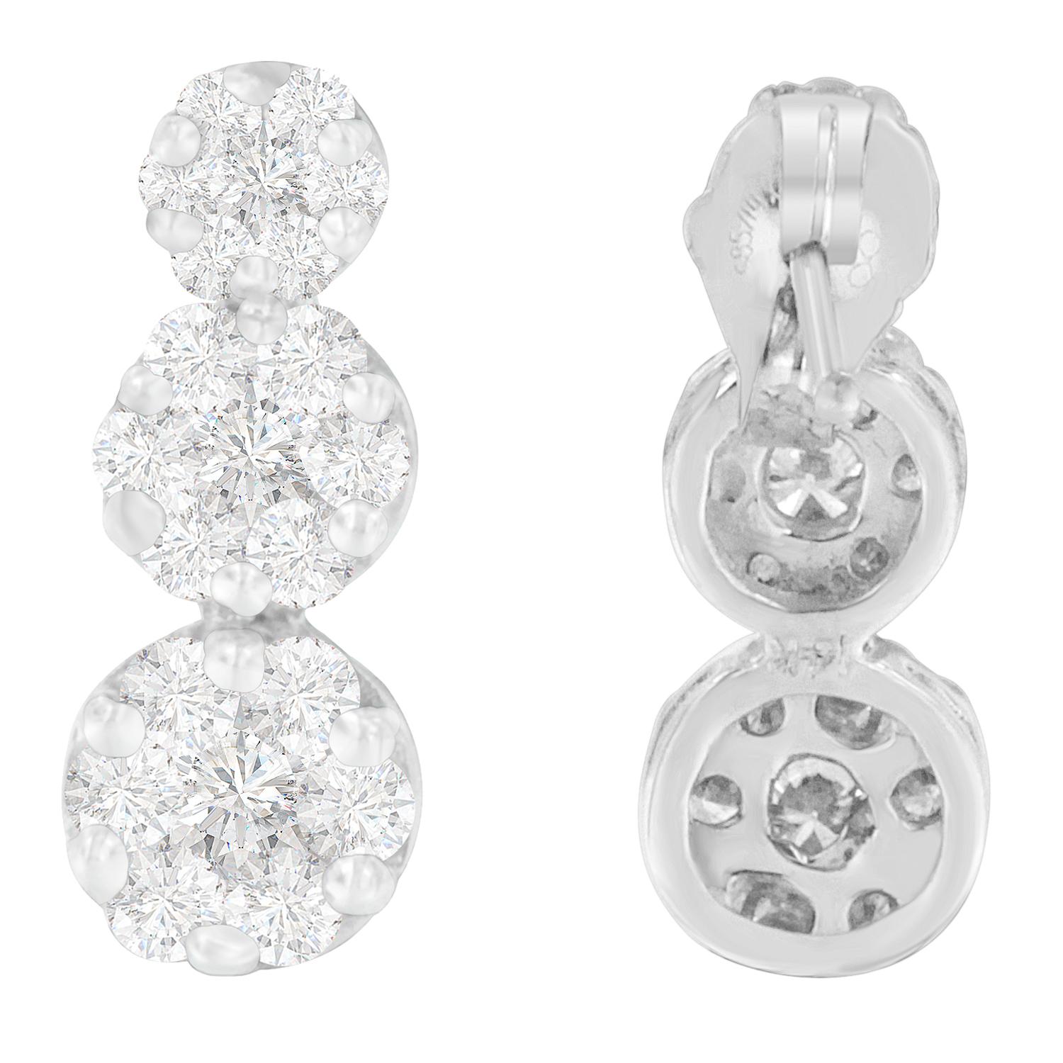 She will adore her look when she wears these diamond dangle earrings. Composed of lustrous 14 karats white gold, it features three round shaped accents in different sizes. Each of the earrings is adorned with sparkling round cut diamonds that are