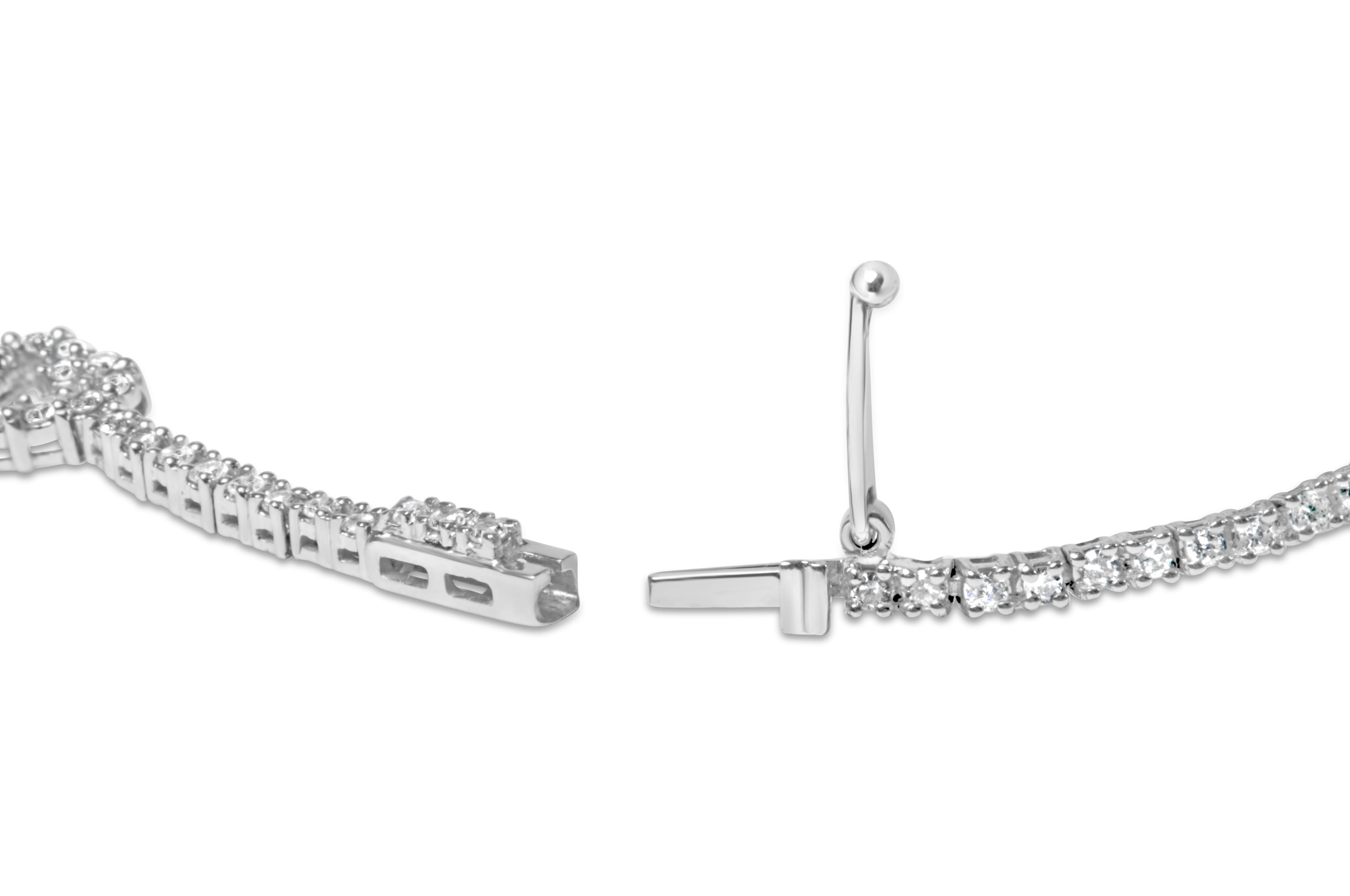 Indulge in the ultimate symbol of love and elegance with our stunning heart design diamond tennis bracelet. This exquisite piece is crafted from 14K white gold and features 145 natural round diamonds, totaling 1 1/2 carats. The diamonds are expertly