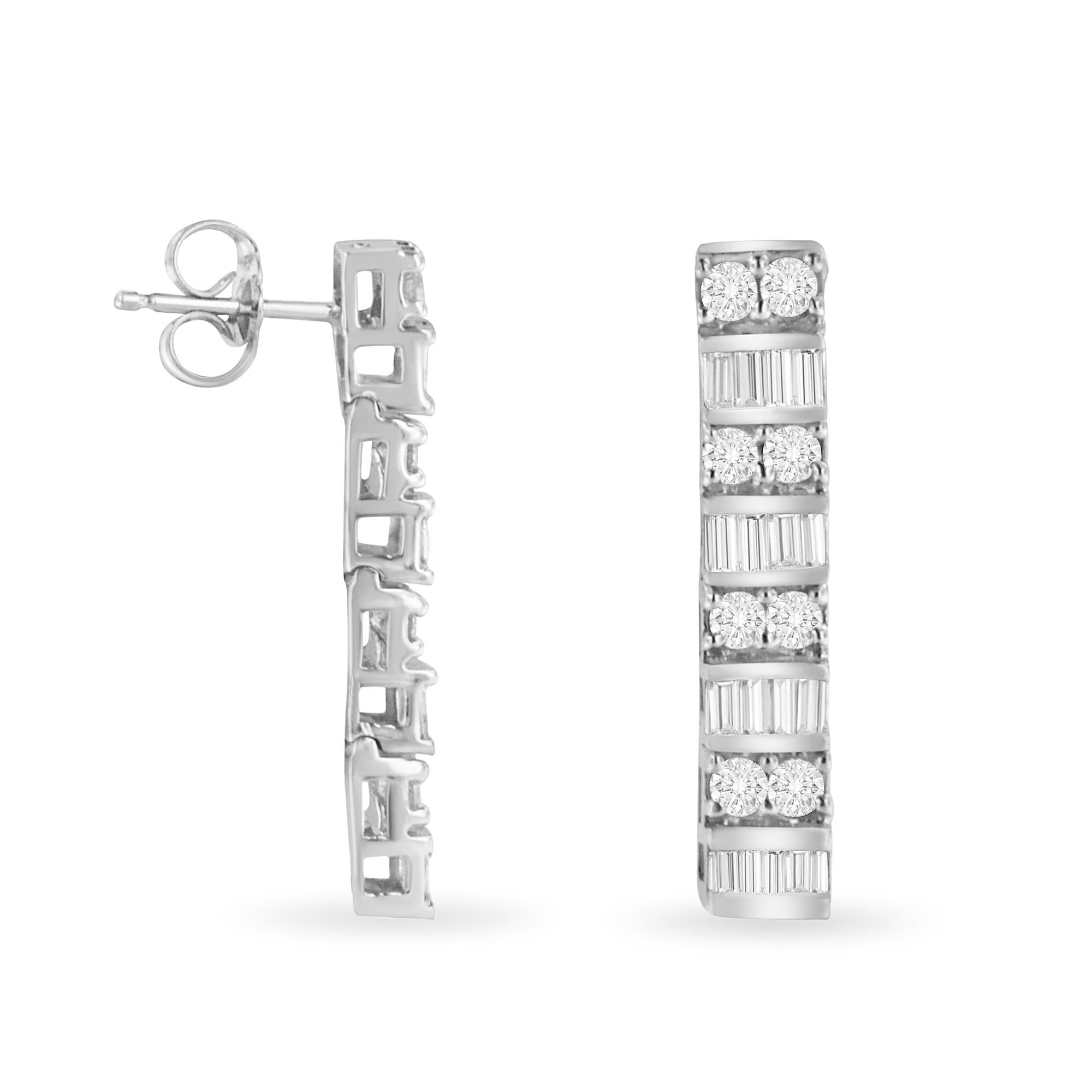 Sparkling with elegance, this 14k white gold dangle earring design features horizontal rows of round and baguette cut diamonds.  White diamonds and high quality precious metal are polished to capture the most light.  Clasped with push backs for a