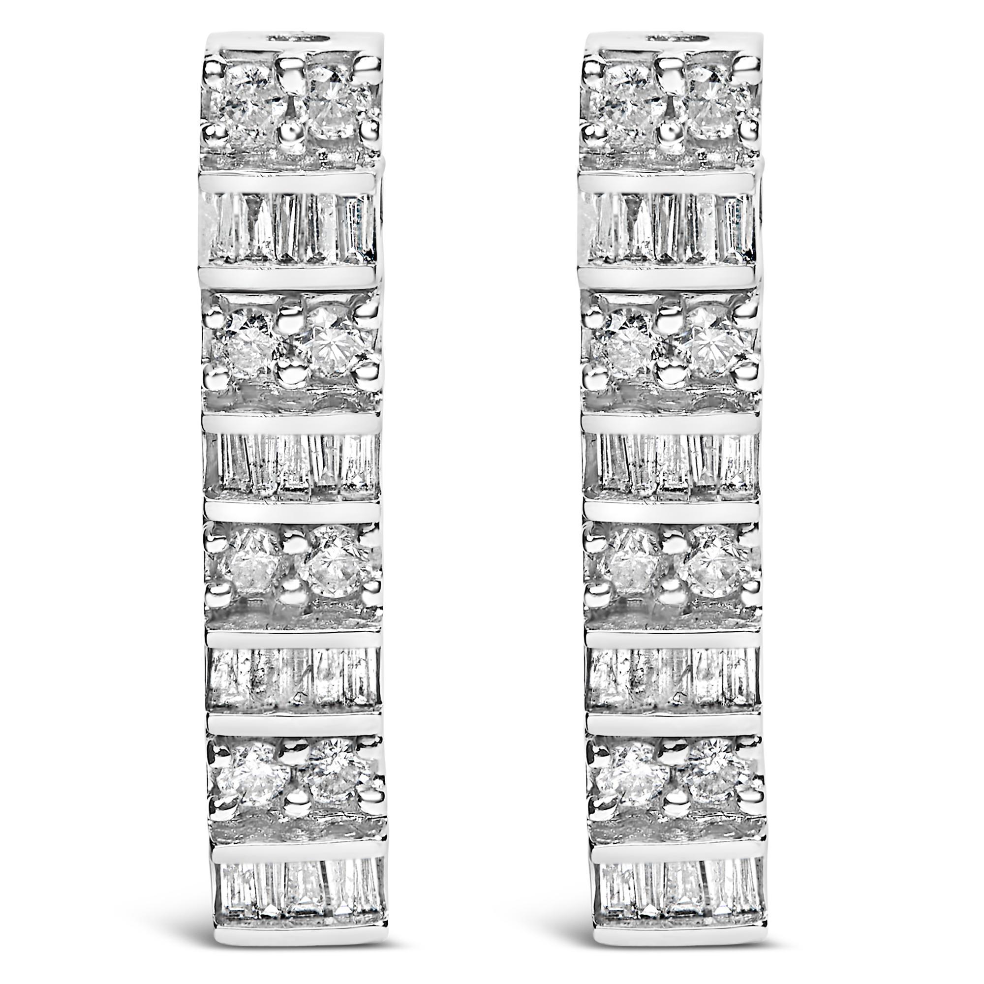 Experience the sheer elegance and timeless charm of these exquisite drop earrings, masterfully crafted from rhodium-plated 14K white gold. Detailed with natural diamonds, summing up to 1 1/3 carats, these earrings shimmer with alternating rows of