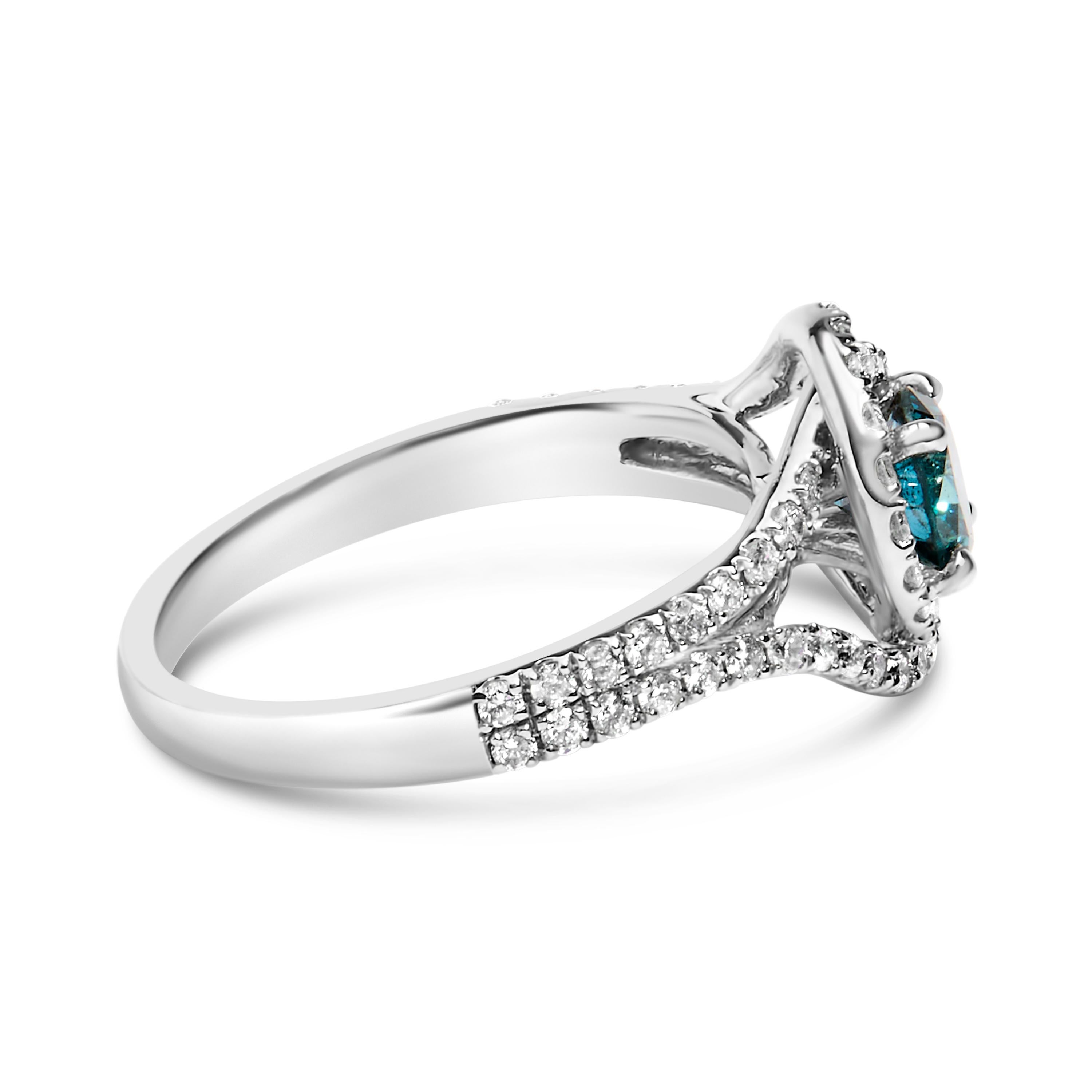 Elegant and timeless, this gorgeous 14K white gold blue and white diamond cocktail ring features 1.34 carat total weight of diamonds with a whopping 67 individual stones. The fashion ring features a large round, brilliant cut fancy heat treated blue