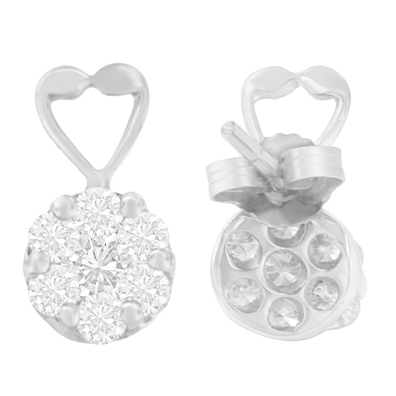 Stunning and elegant, these composite diamond earrings shimmer with 1 1/4 carat of genuine, shimmering diamonds. A high-polish finish enhances the 14k gold construction, completing the heart shaped jewelry with a lustrous finish. These natural