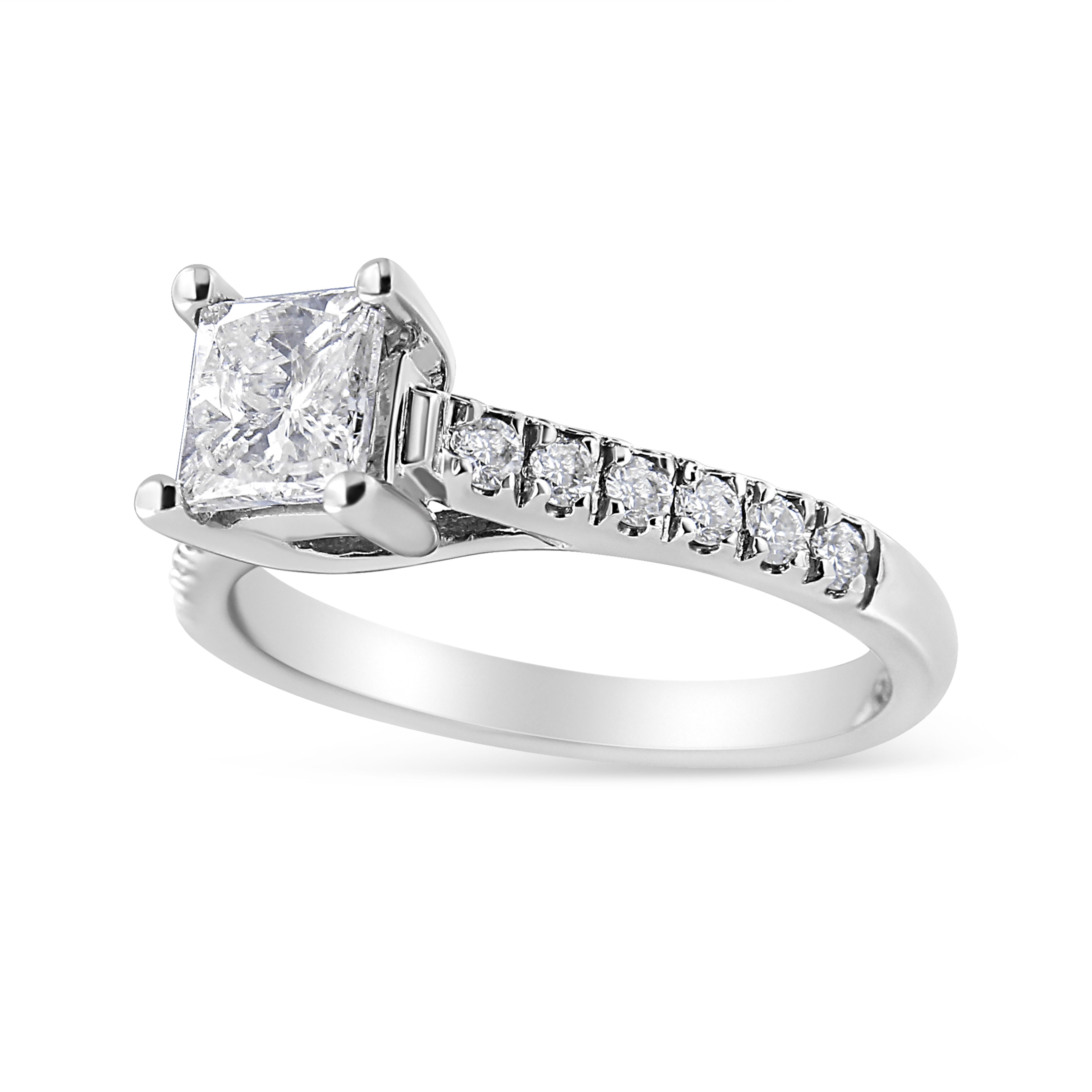 Express all the love you hold in your heart for that special someone with this shimmering diamond engagement ring. Eye-catchingly beautiful, this 14k white gold ring sparkles with 1 1/5 carats of natural, gleaming diamonds. 4 Prongs hold a stunning
