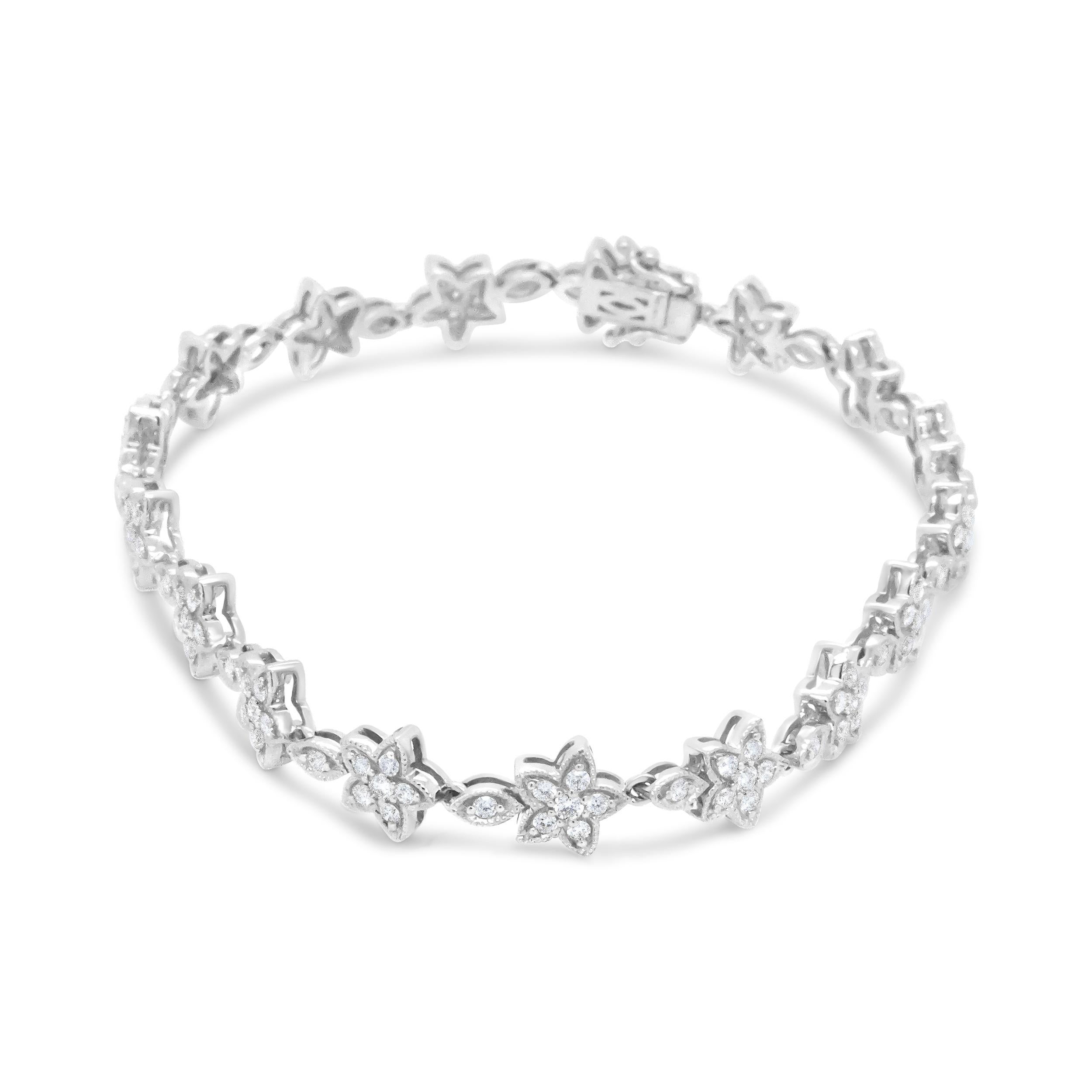 Wear the romance of a moonlit garden on your wrist with this gorgeous link bracelet featured 14k white gold with brilliant white diamonds arranged in prong settings. This fashion bracelet is arranged in a flower blossom silhouette, with diamonds