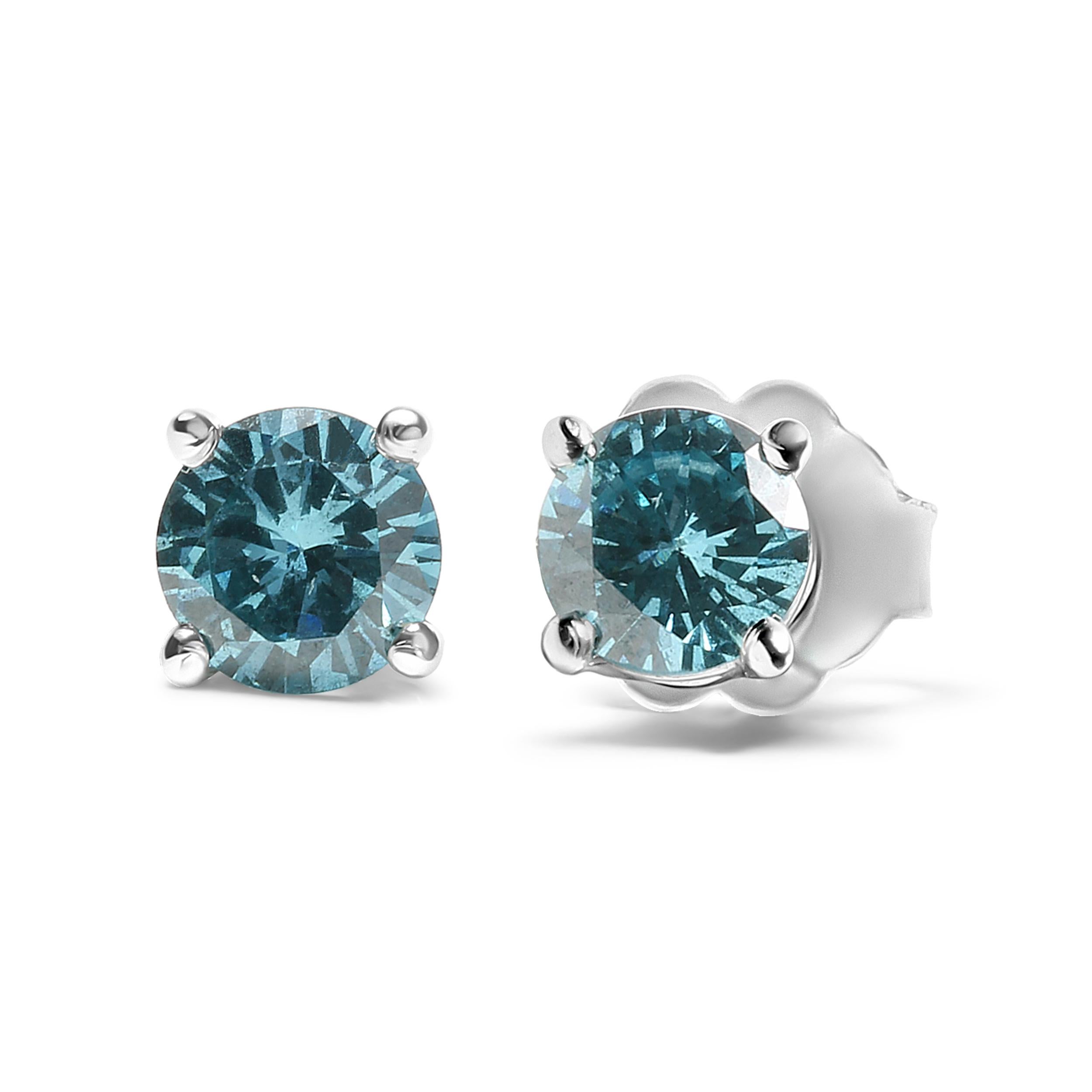 Add a touch of brilliance to your everyday look with these exquisite 14K White Gold stud earrings. Embellished with two shimmering round-cut aqua blue diamonds, each earring is a vision of beauty and elegance. These earrings are perfect for those
