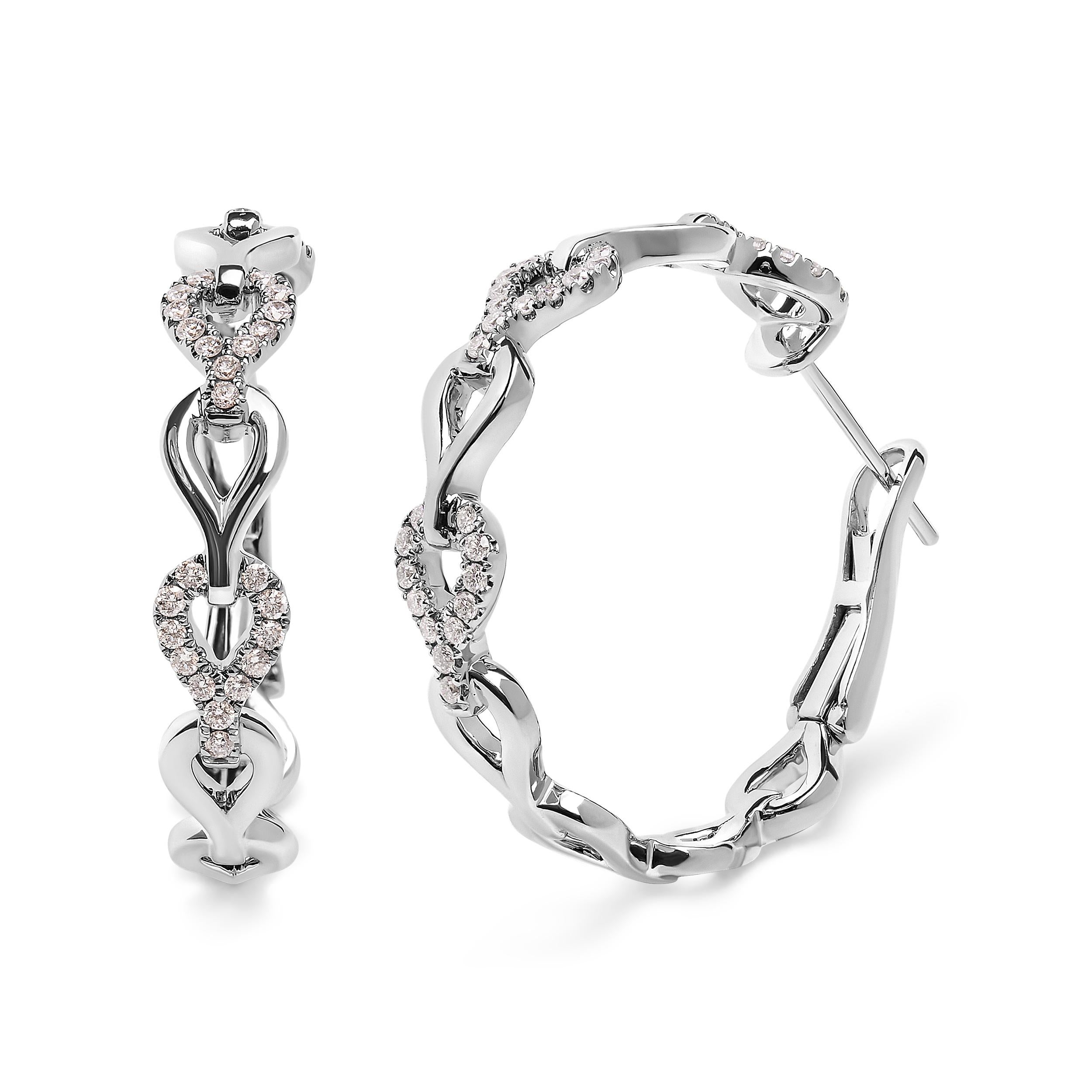 Introducing our exquisite 14K White Gold Hoop Earrings, a dazzling masterpiece that will leave you breathless. Crafted with love and care, these earrings feature a stunning heart link design, symbolizing eternal love and beauty. Adorned with 74