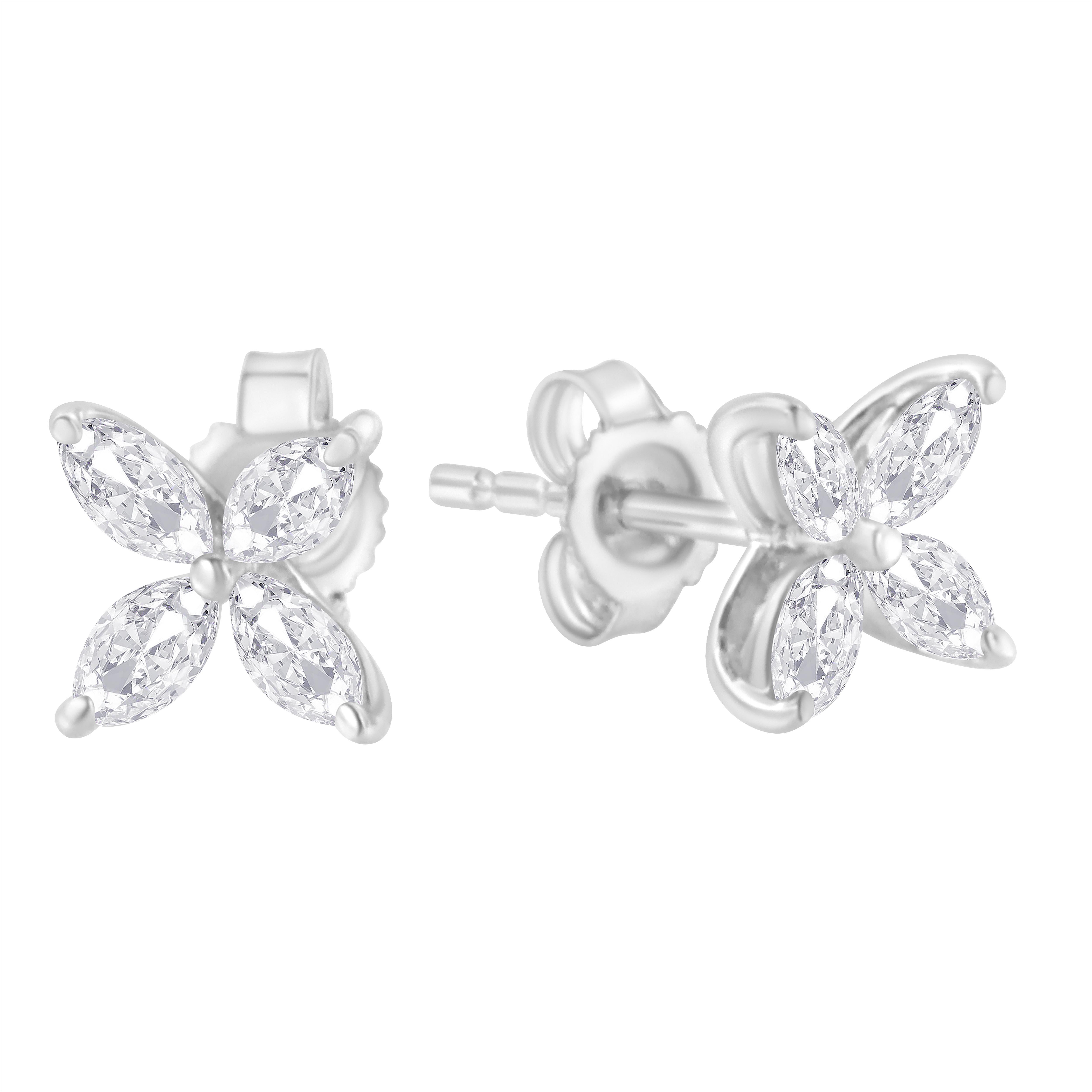 A pair of floral diamond earrings featuring four marquise shaped diamonds arranged to resemble a flower. These delicate earrings are crafted in 14 karat white gold, and have a total diamond weight of 1/2 carat. These diamonds are color rated as H-I