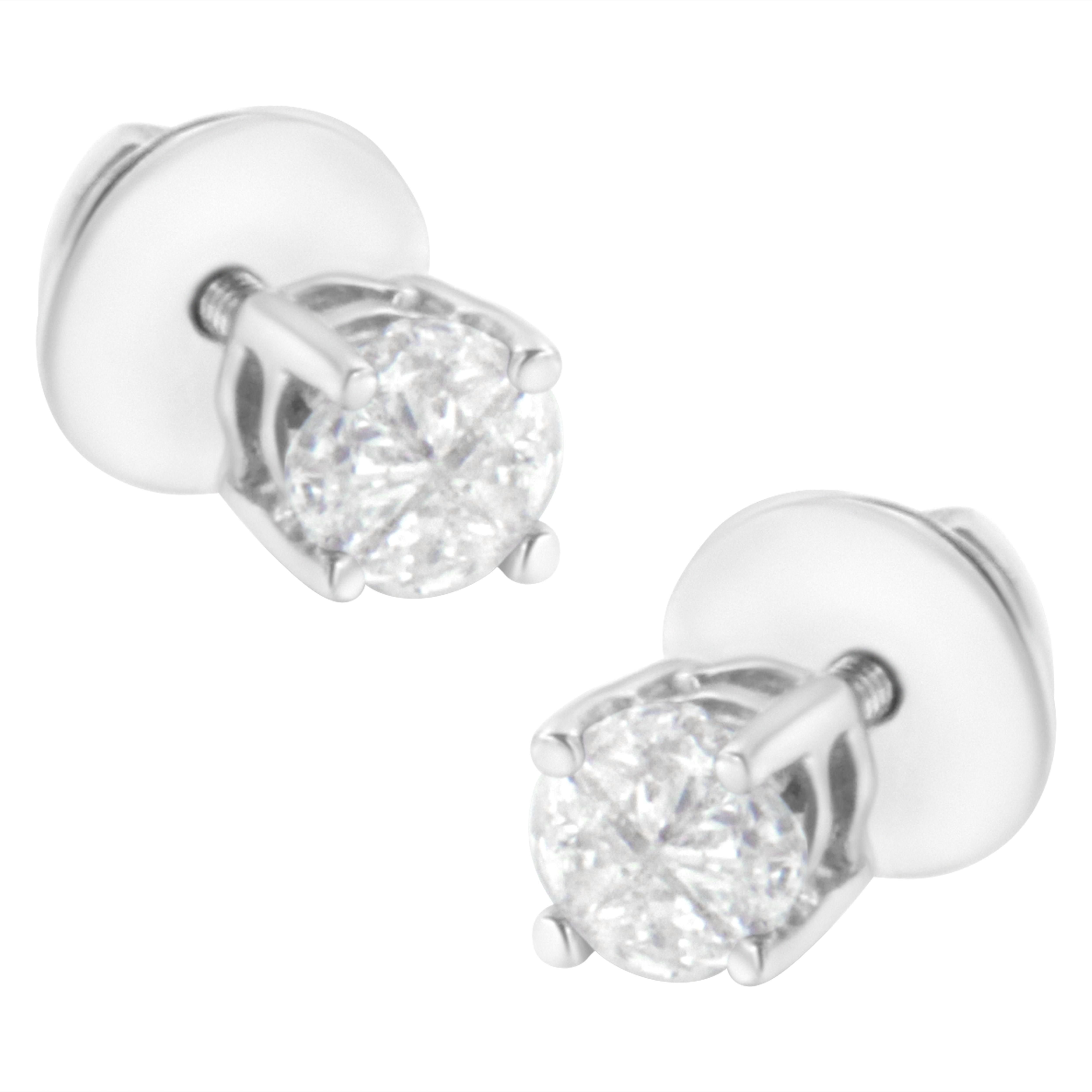 Adorn yourself with these lovely and sparkling solitaire earrings. Each stud is embellished with 4 natural, pie-cut diamonds in a classic prong setting. The 4 pie cuts come together to create the illusion of a round diamond. The diamonds have a