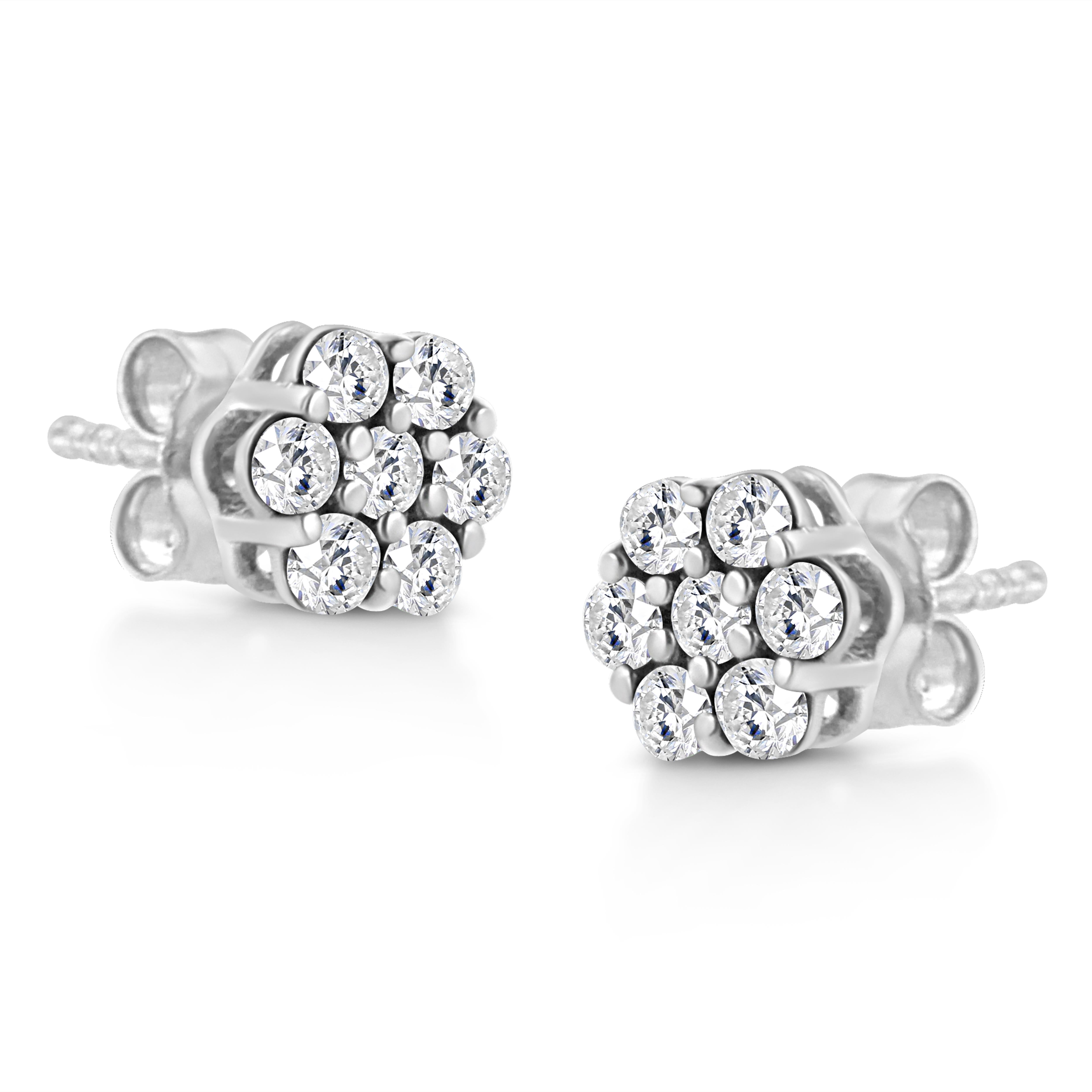 These gorgeous floral cluster stud earrings are the perfect piece to add to your jewelry collection. Created in the finest 14k white gold, these studs boast 7 natural round-cut diamonds in an elegant prong setting. Boasting a total carat weight of