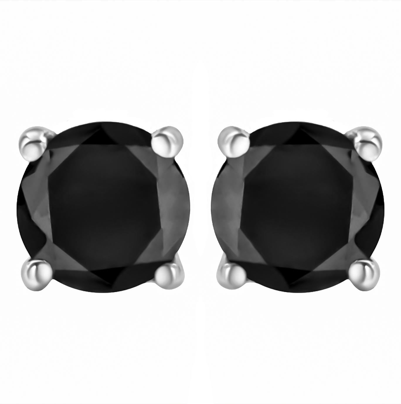 Elegant and timeless, these gorgeous 14K white gold solitaire stud earrings feature bold and beautiful heat treated, color enhanced black diamonds in a bezel setting. The earrings feature screwback closures. The notched posts and friction backs keep