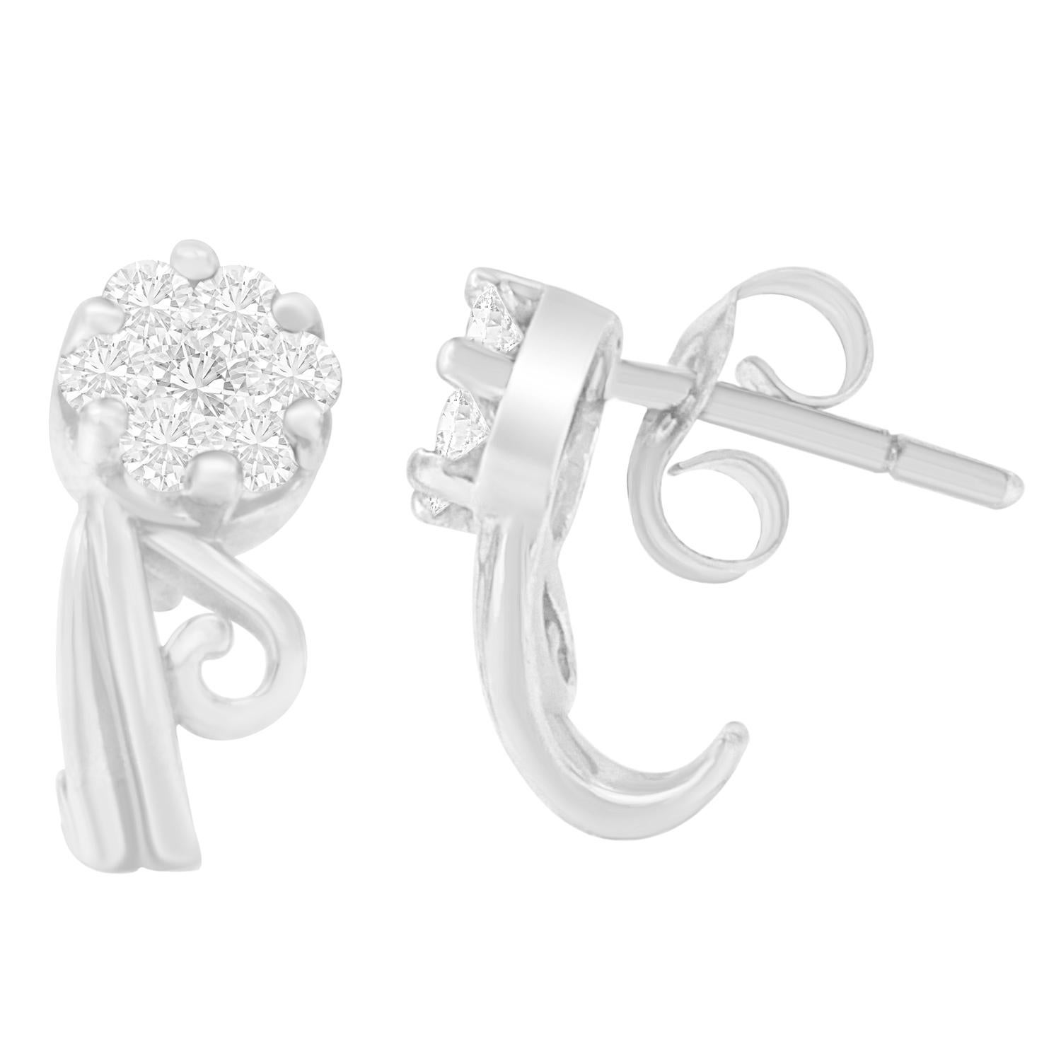 Touch the new heights of your love life by giving her these beautiful earrings. Designed with elegance by giving attention to every detail, the earrings are created with 14 karats white gold. Featuring a unique design, the earrings are ornate with