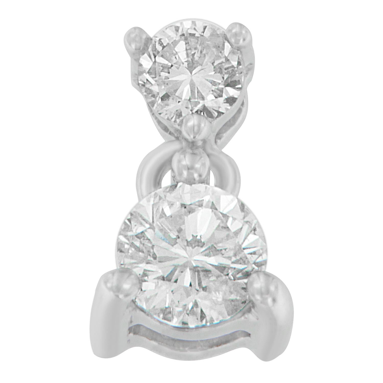 Keep your adorable little girl close to your heart with this elegant diamond pendant. This little piece of jewel sparkles in half a karat of round cut diamonds that are prong set in 14 karats white gold. Polished high to shine, it comes with box