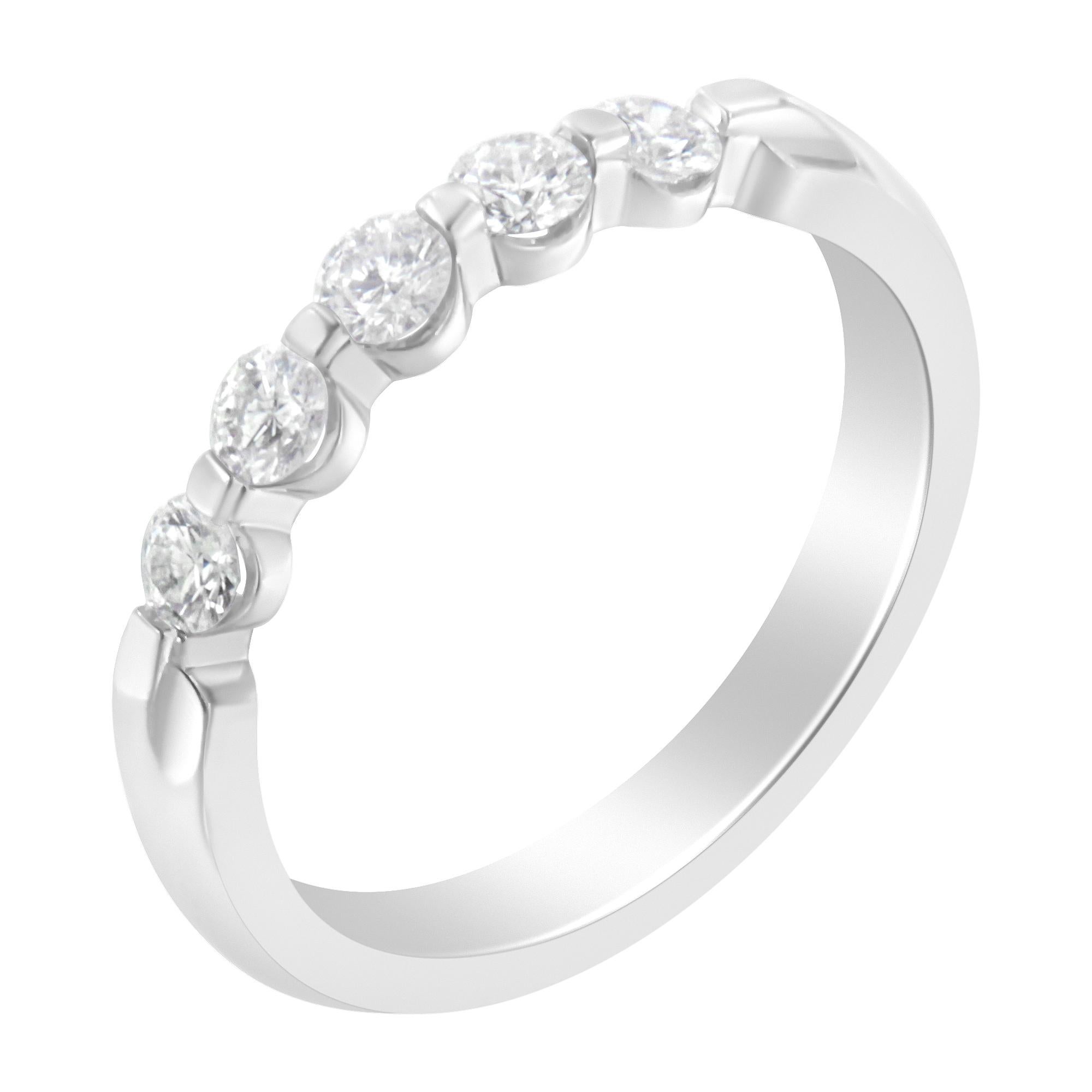 Make a bold and beguiling style statement with this phenomenal diamond ring. Fashioned in cool 10kt white gold, this stunning fashion ring is lined with the beautiful ribbon of round cut diamonds. Framed in the channel setting, the polished shine of