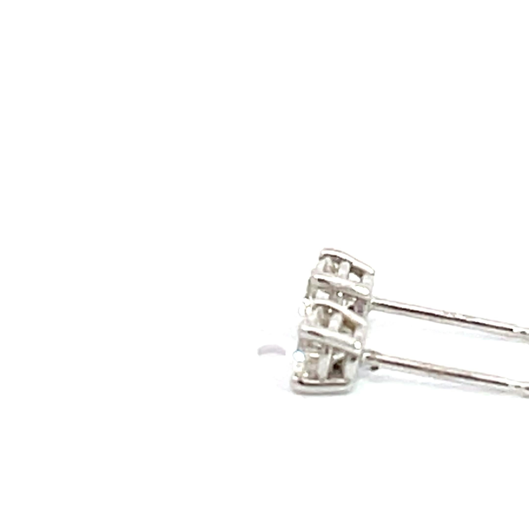The 14K White Gold 0.50 carat Diamond 4 prong studs are a dazzling pair of earrings that exude elegance and sophistication. Crafted from high-quality 14K white gold, these studs showcase a timeless design that will never go out of style. The 0.50