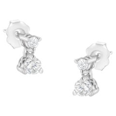 Clous d'oreilles en or blanc 14 carats avec double diamant de 1/3 carat