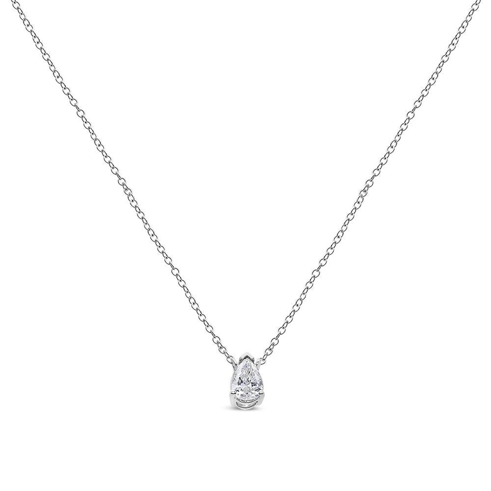 Exquisitely crafted, this solitaire diamond pendant necklace brilliantly showcases a 1/3 cttw pear-shaped diamond, nestled in a 3-prong. It is crafted in genuine 14k white gold, a metal that will stay tarnish free for years to come. The diamond is