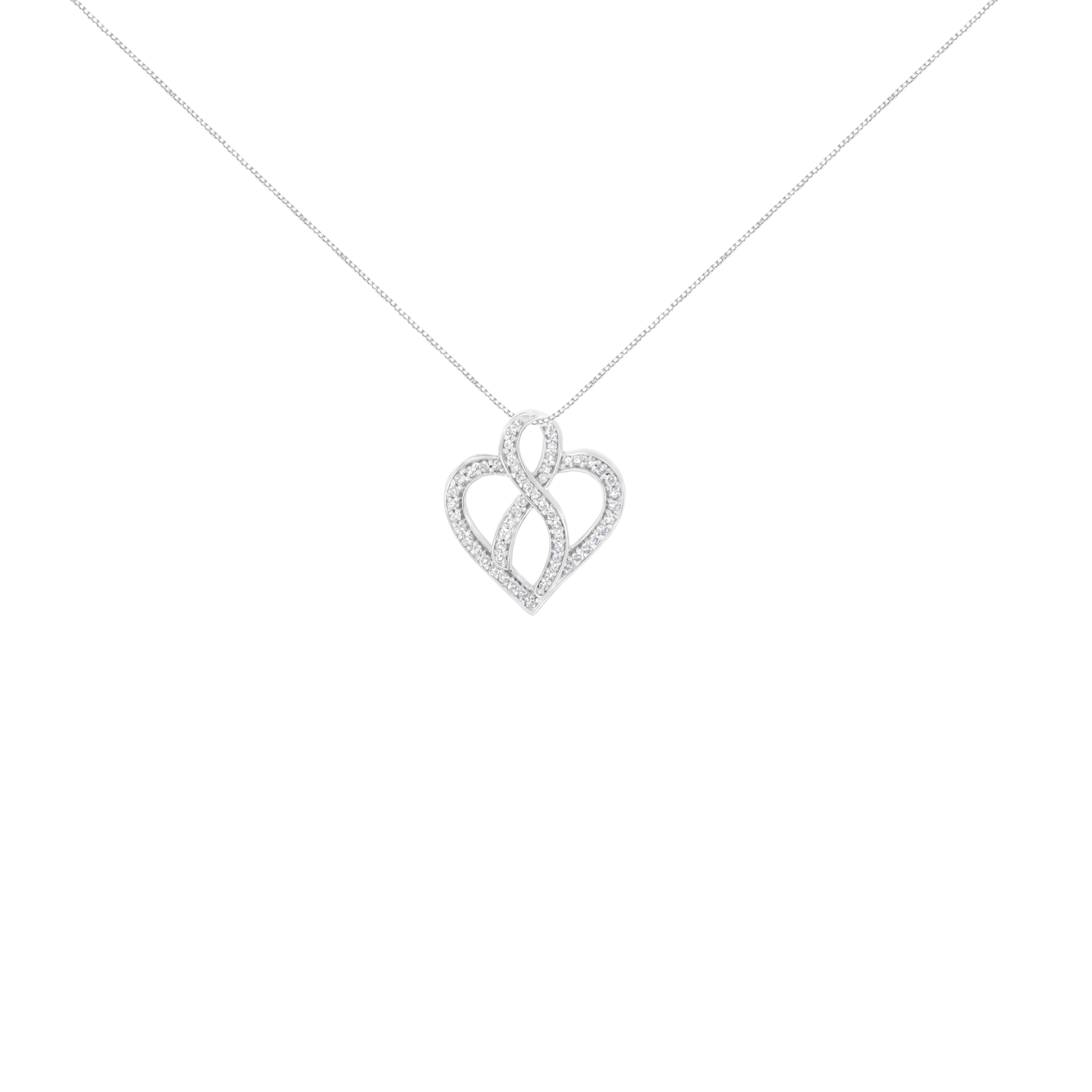 Live, Love, Sparkle, and Repeat with this alluring diamond pendant. Crafted of 14 karats white gold, the piece of jewel is polished finely. It features a lovely heart shape, which is enriched with delicate ribbon design from the center. It is