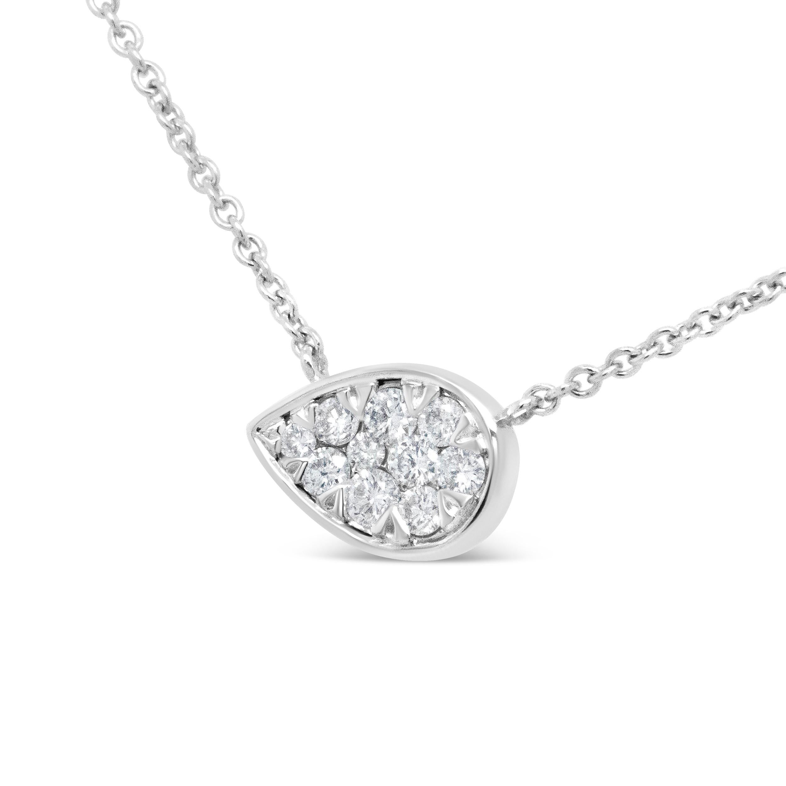 This 14k white gold necklace is alive with feminine energy and grace, emboldened by a horizontal teardrop silhouette comprised of a cluster of gradual-sized round white diamonds in pave-settings. These diamonds total 1/4 Cttw and are of an